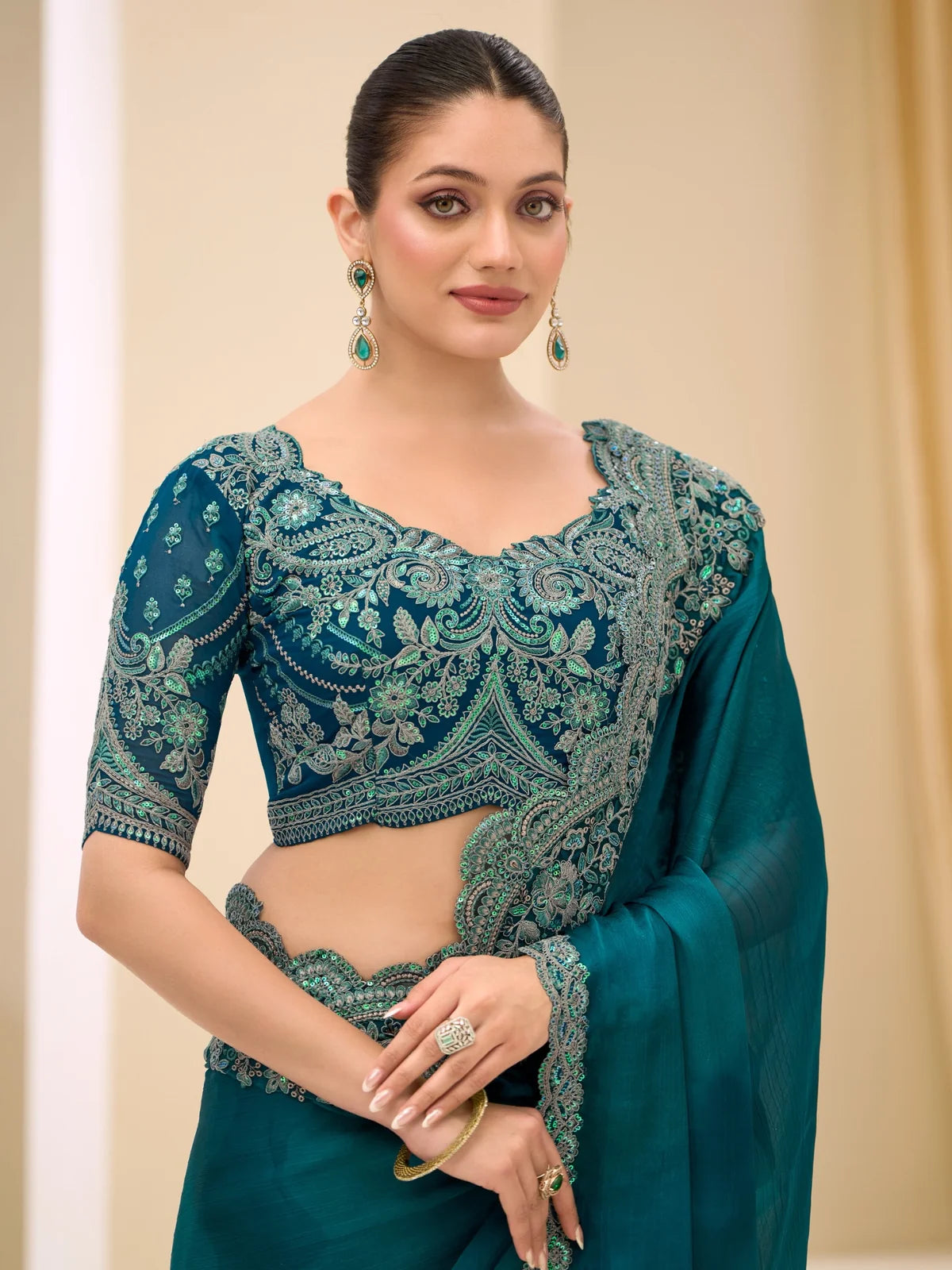 Tarani Agnya upper body view of rama green satin chiffon saree with intricate embroidery work