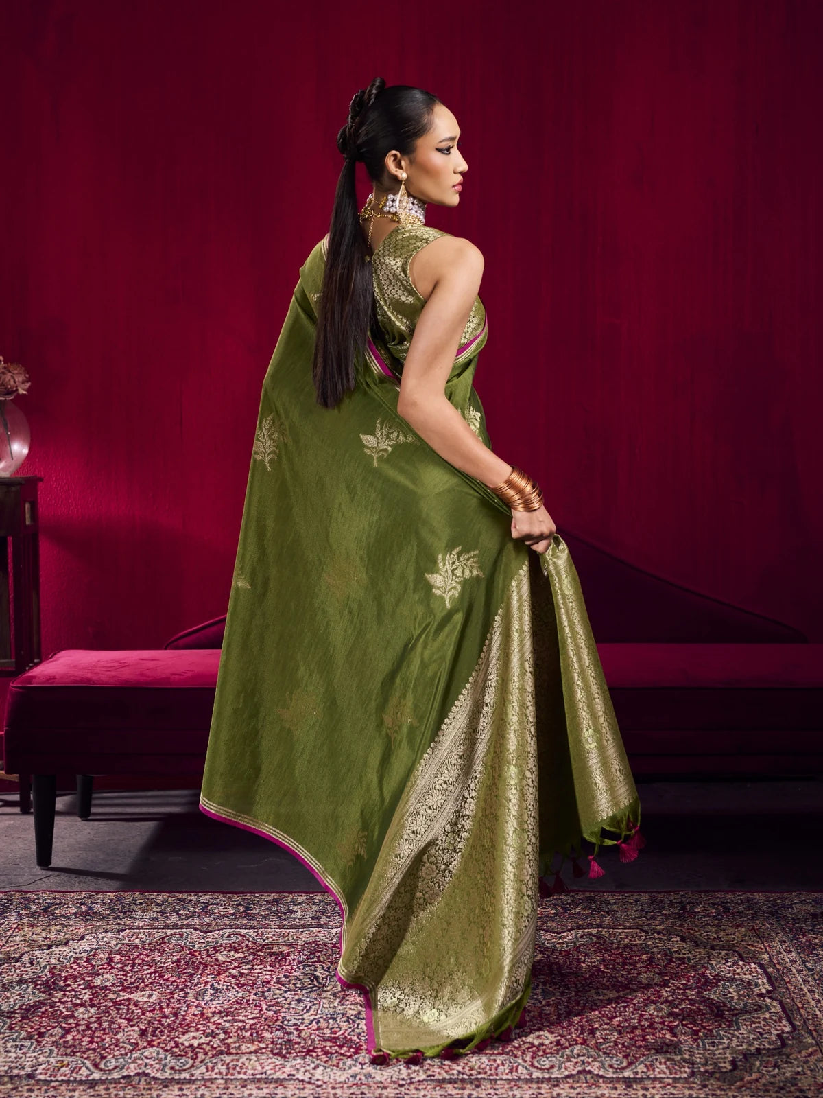 Tarani green satin linen silk saree back view showcasing elegant woven pallu design