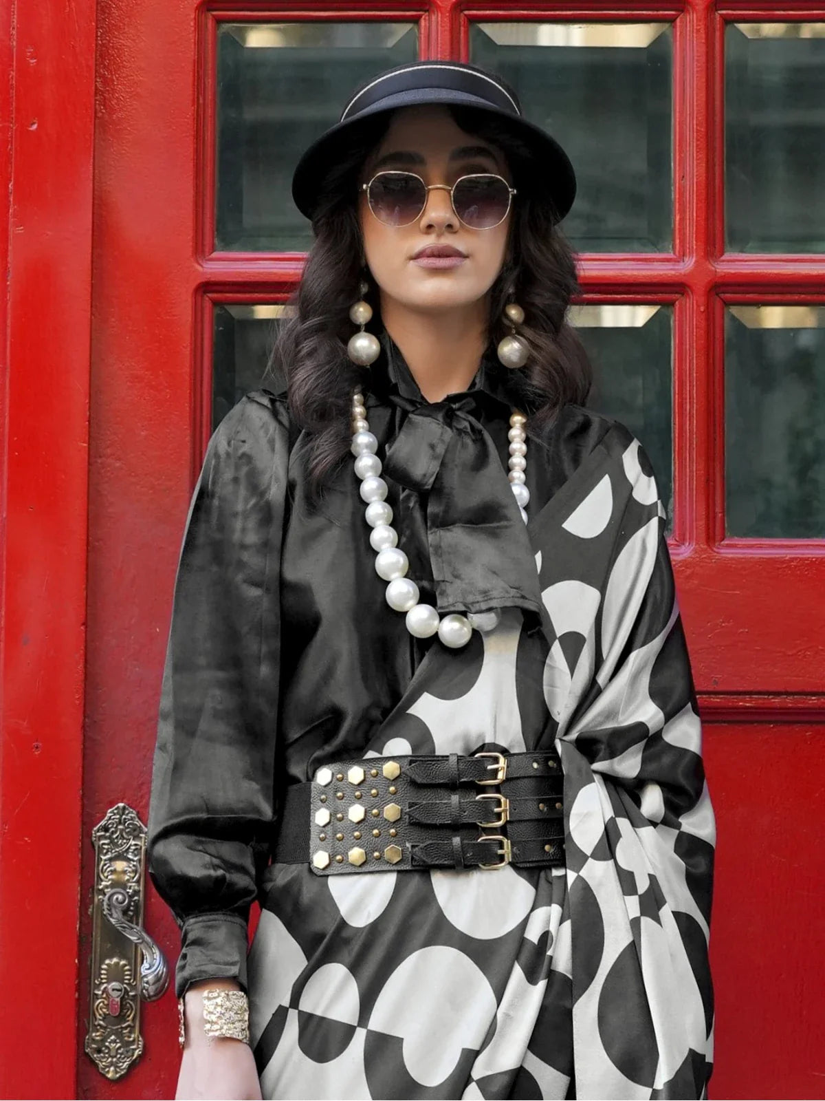 Tarani black satin saree upper body view with modern accessories and layered pearls