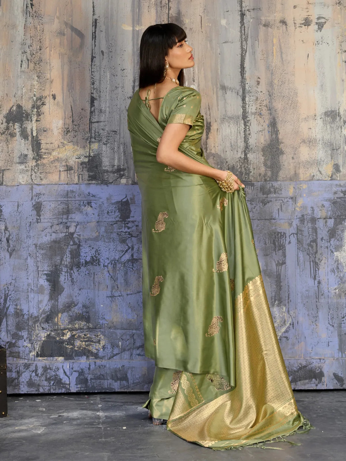 Tarani pure satin green saree back view with elegant woven pallu and traditional drape