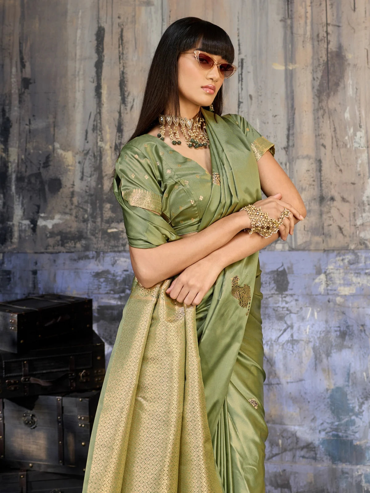 Tarani green satin saree blouse view with woven sleeve border and elegant neckline design