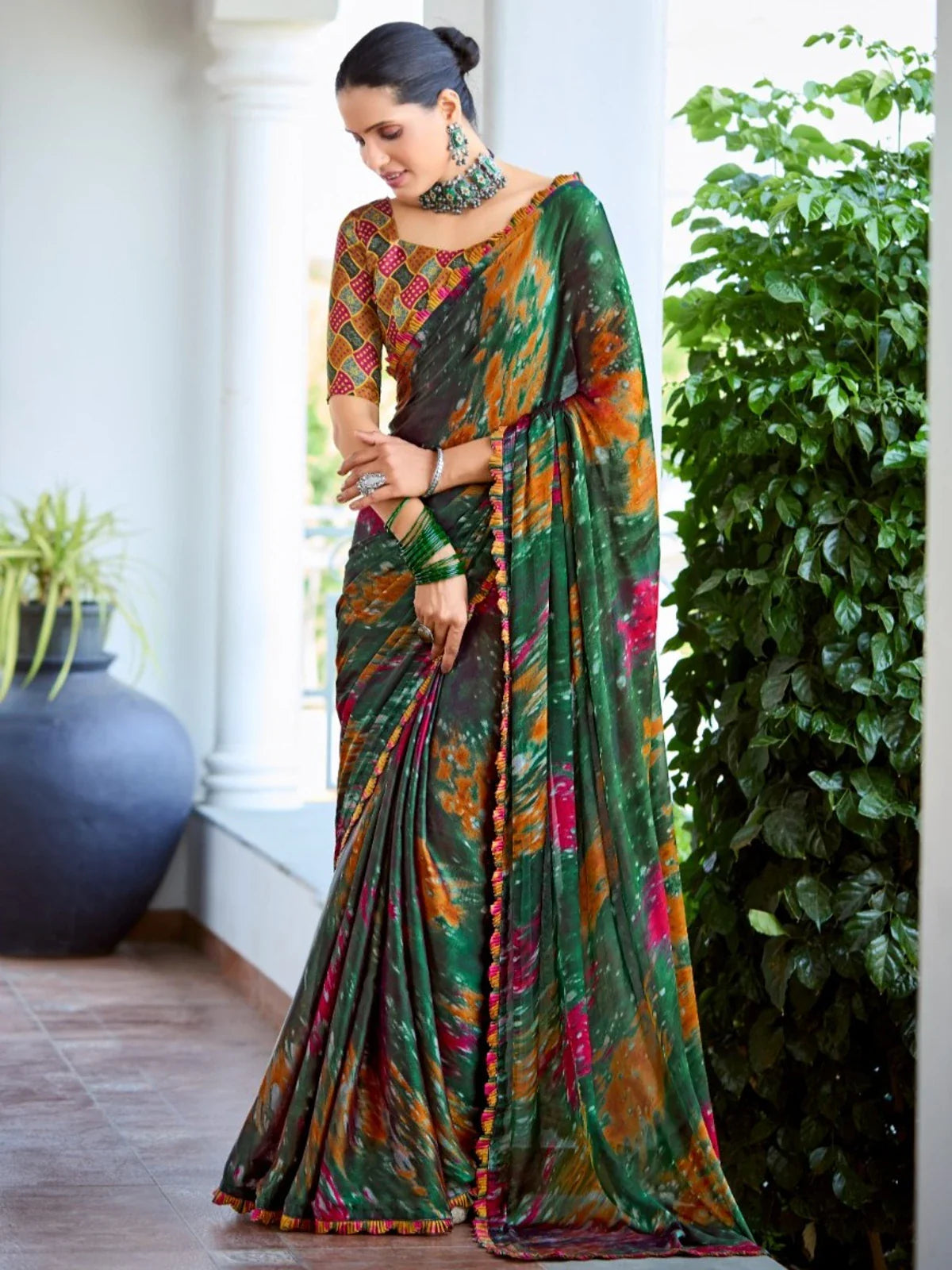 Tarani premium green satin festive saree with orange and magenta hues and matching blouse