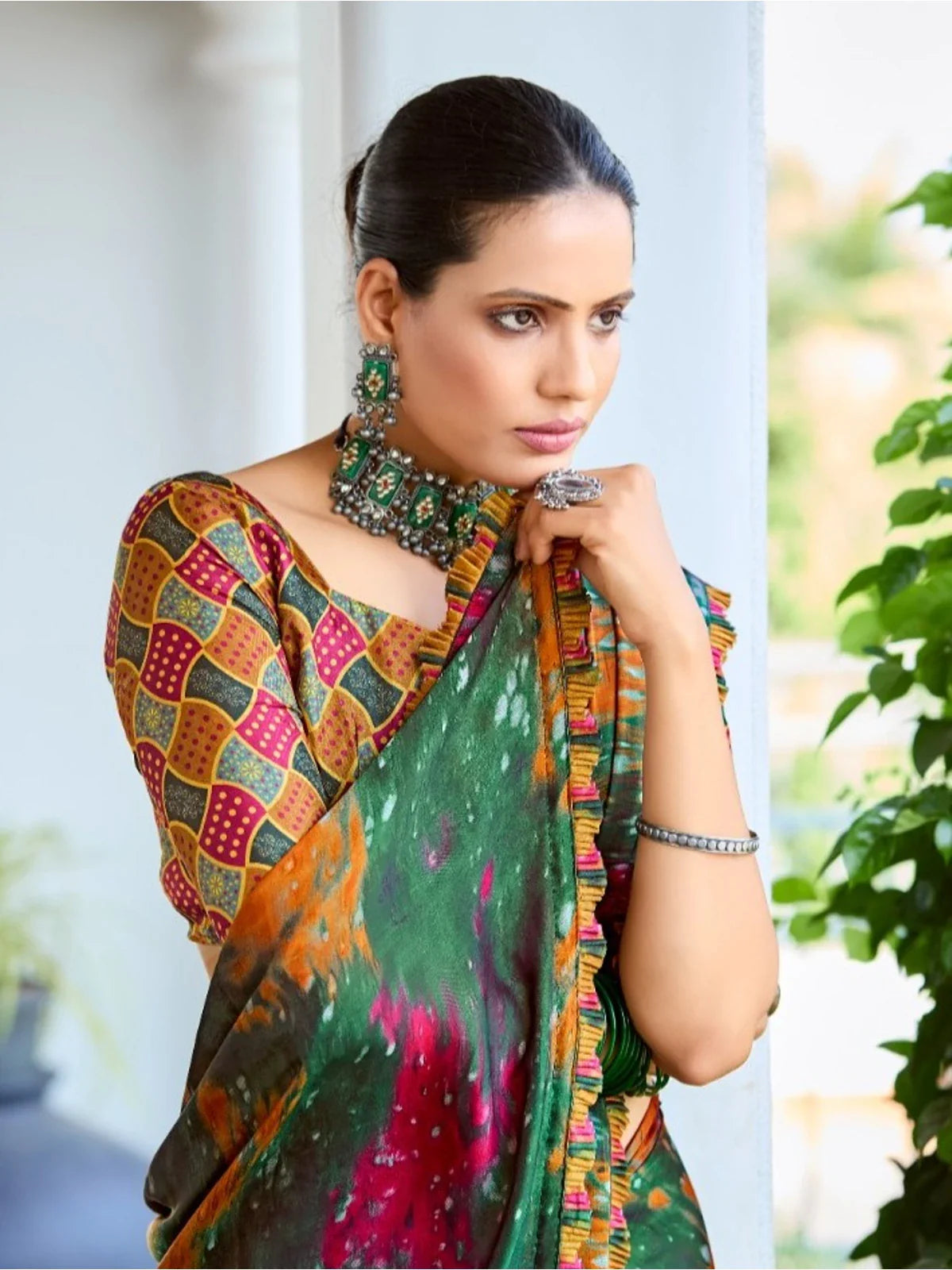 Tarani green satin saree upper body view highlighting festive print and elegant blouse design