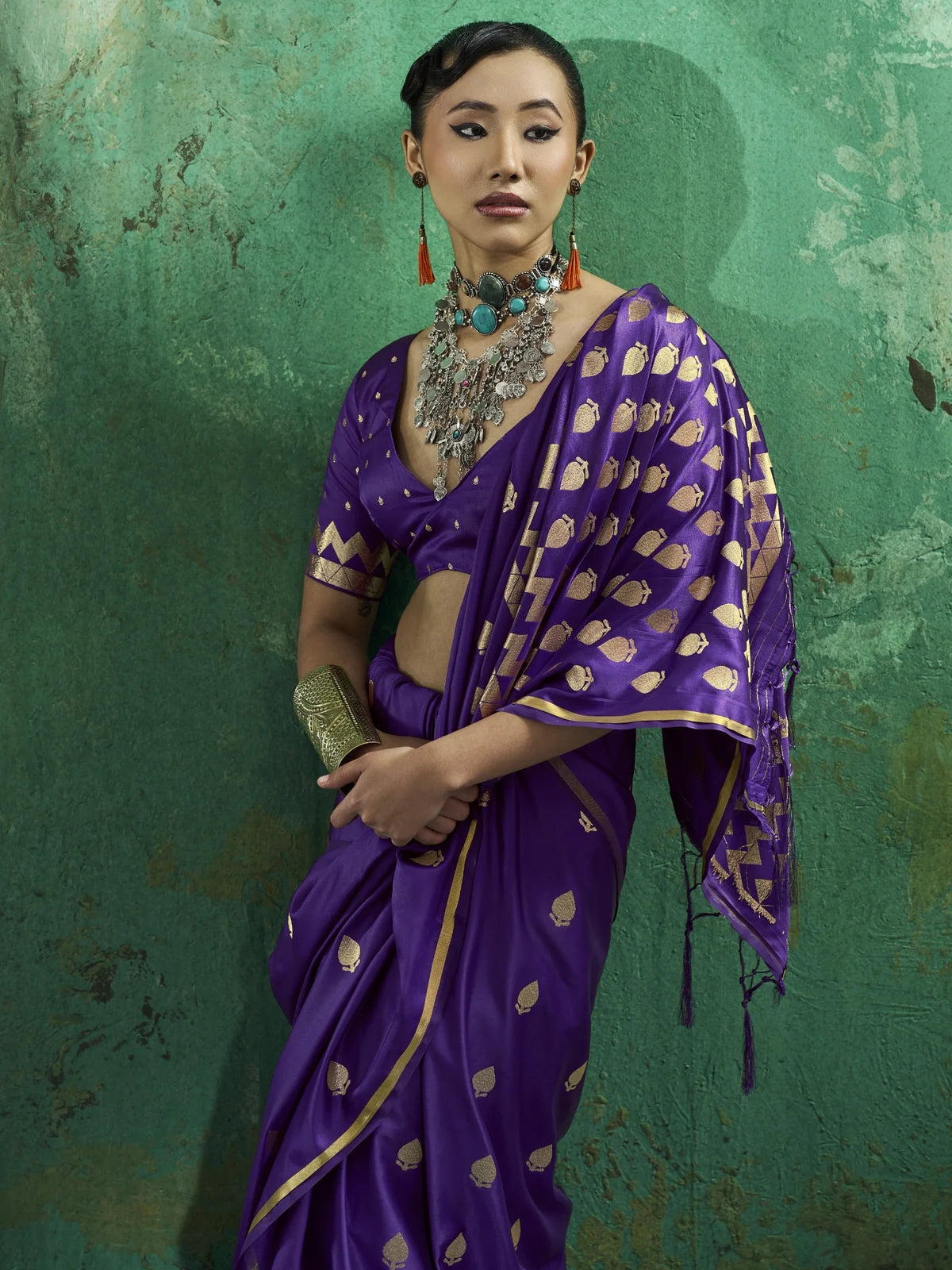 Tarani Eshanya pallu view purple satin saree with rich zari border details
