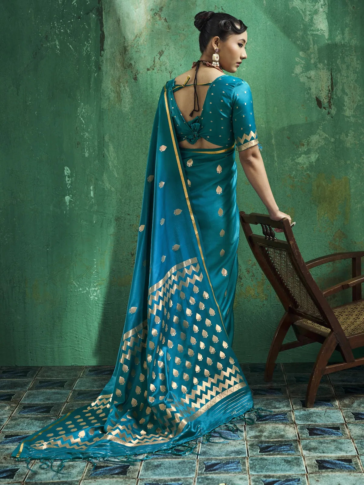 Tarani Sarangi teal saree back view showing blouse design and woven pallu details