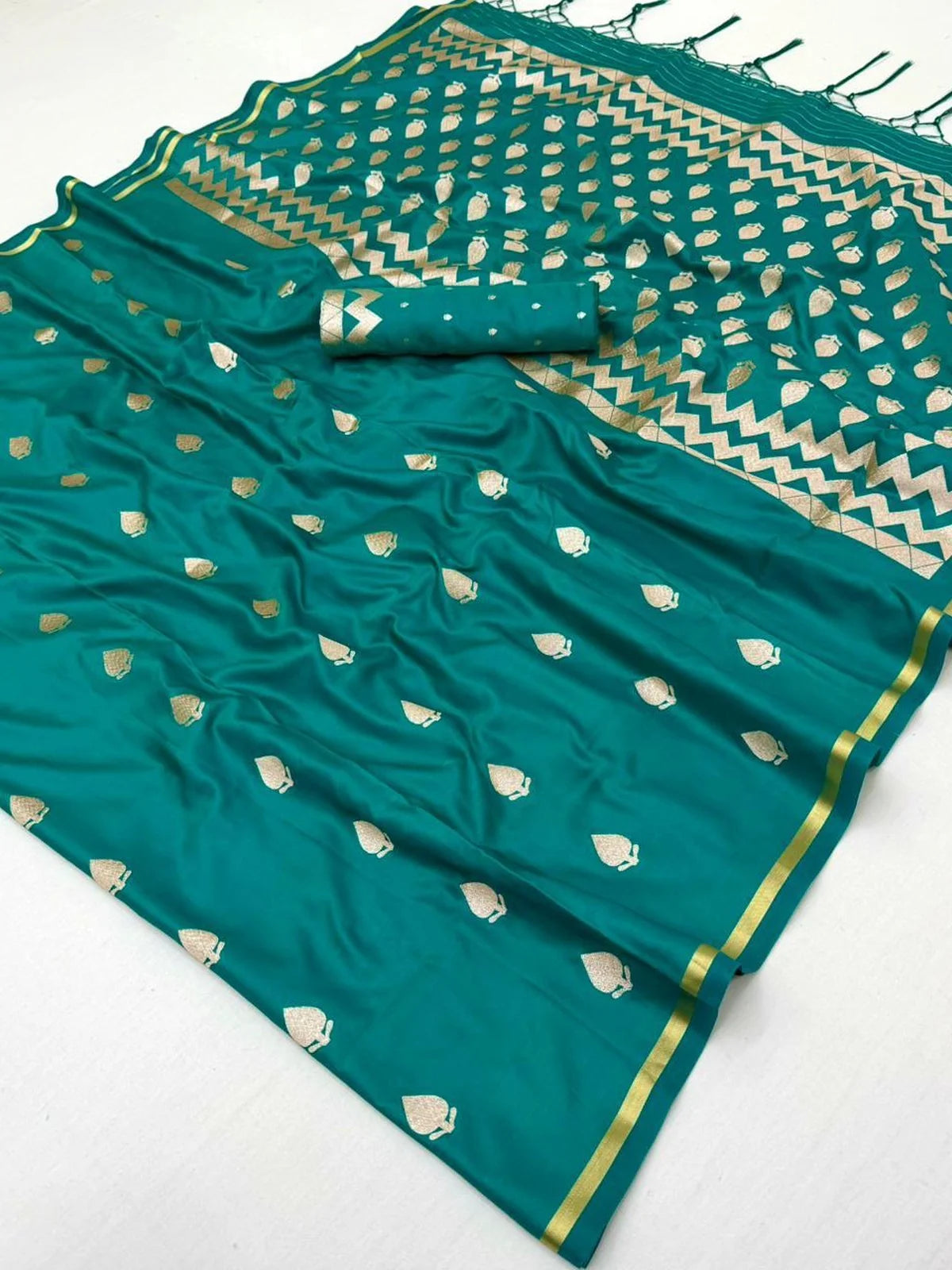 Tarani teal green satin saree pallu view with woven motifs tassels and elegant border