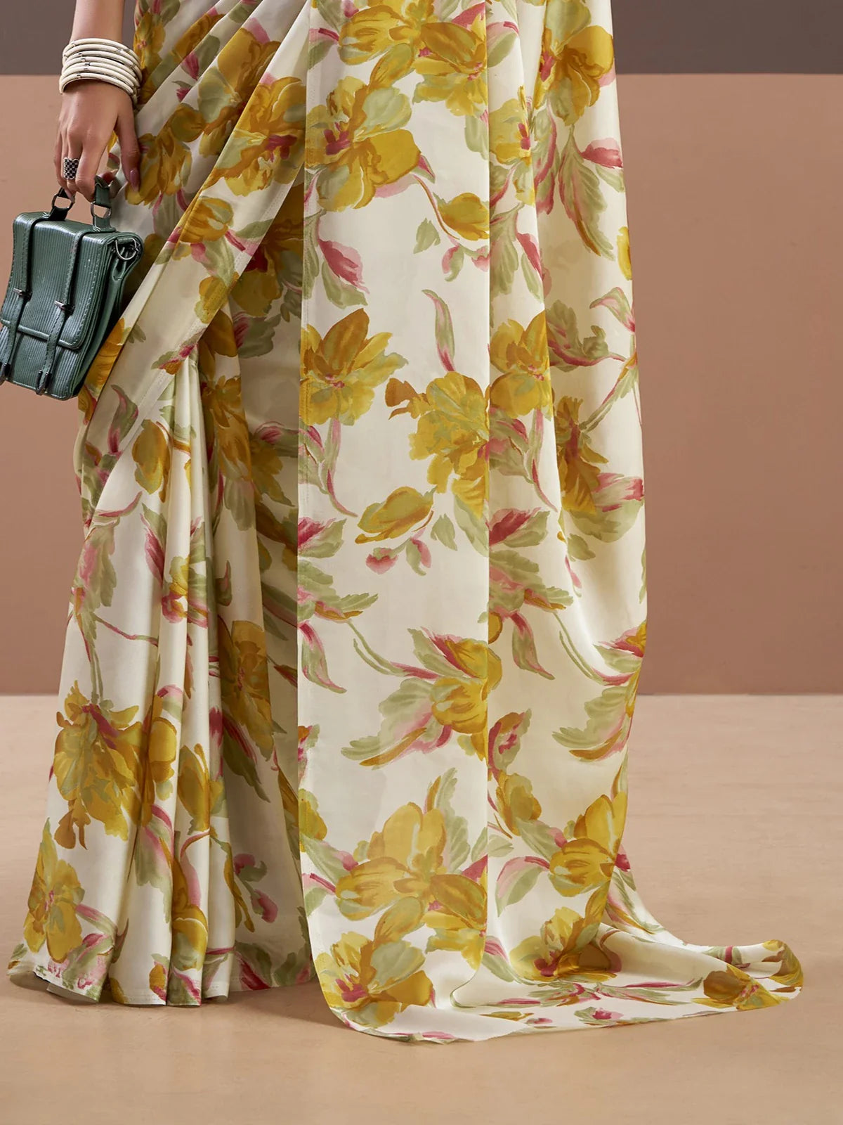 Tarani satin silk saree closeup showing yellow floral print and soft fabric flow