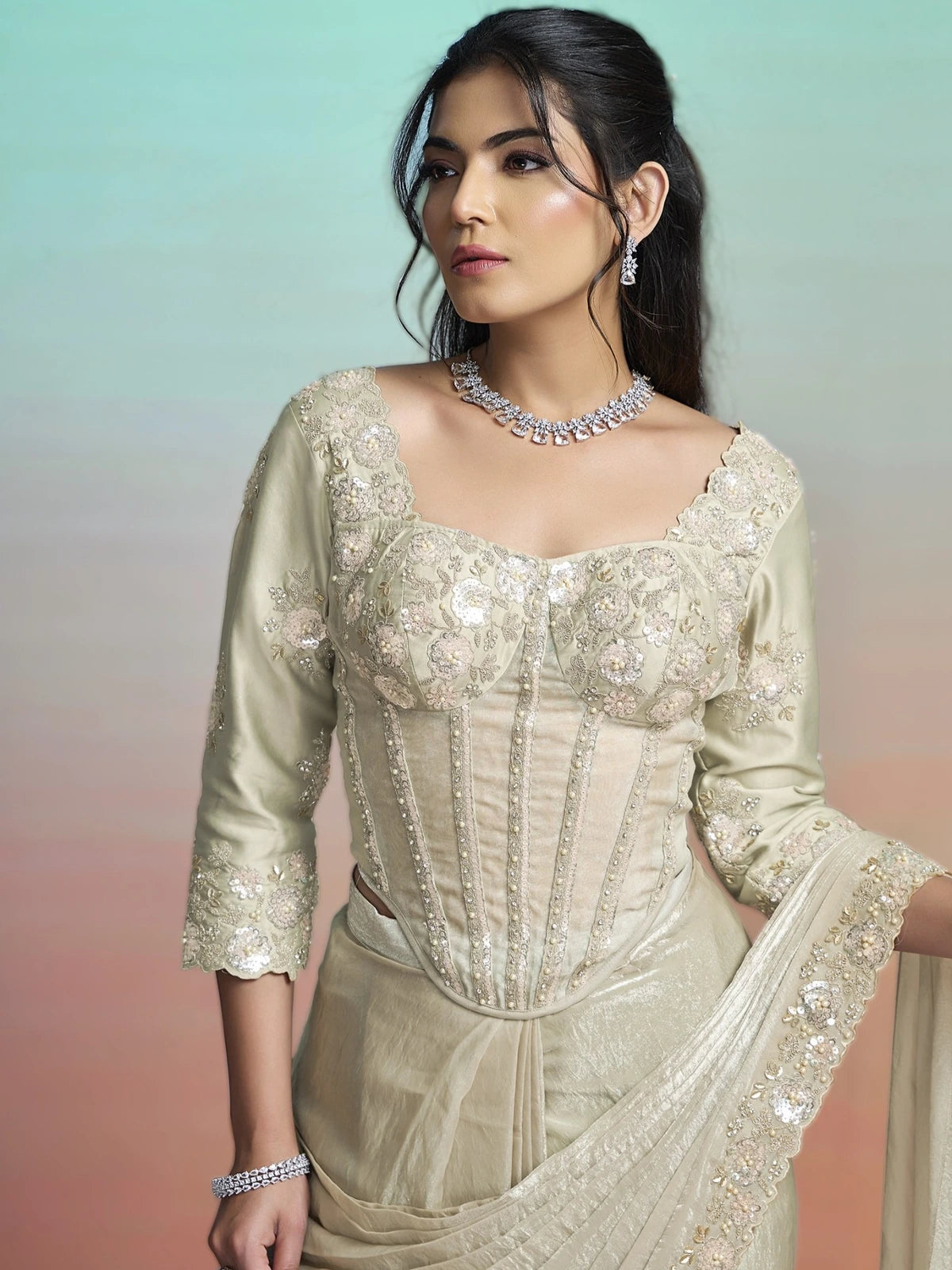 Tarani Harini beige satin silk saree blouse view with floral sequin stone and pearl embroidery