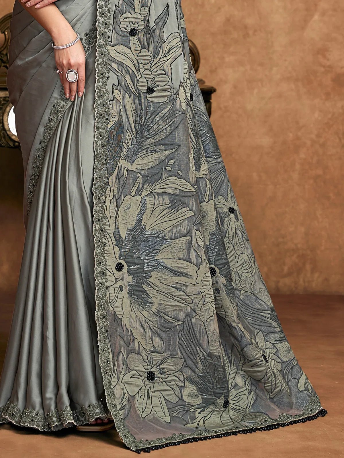 Tarani grey satin silk saree pallu view with floral jacquard weave and embroidered border