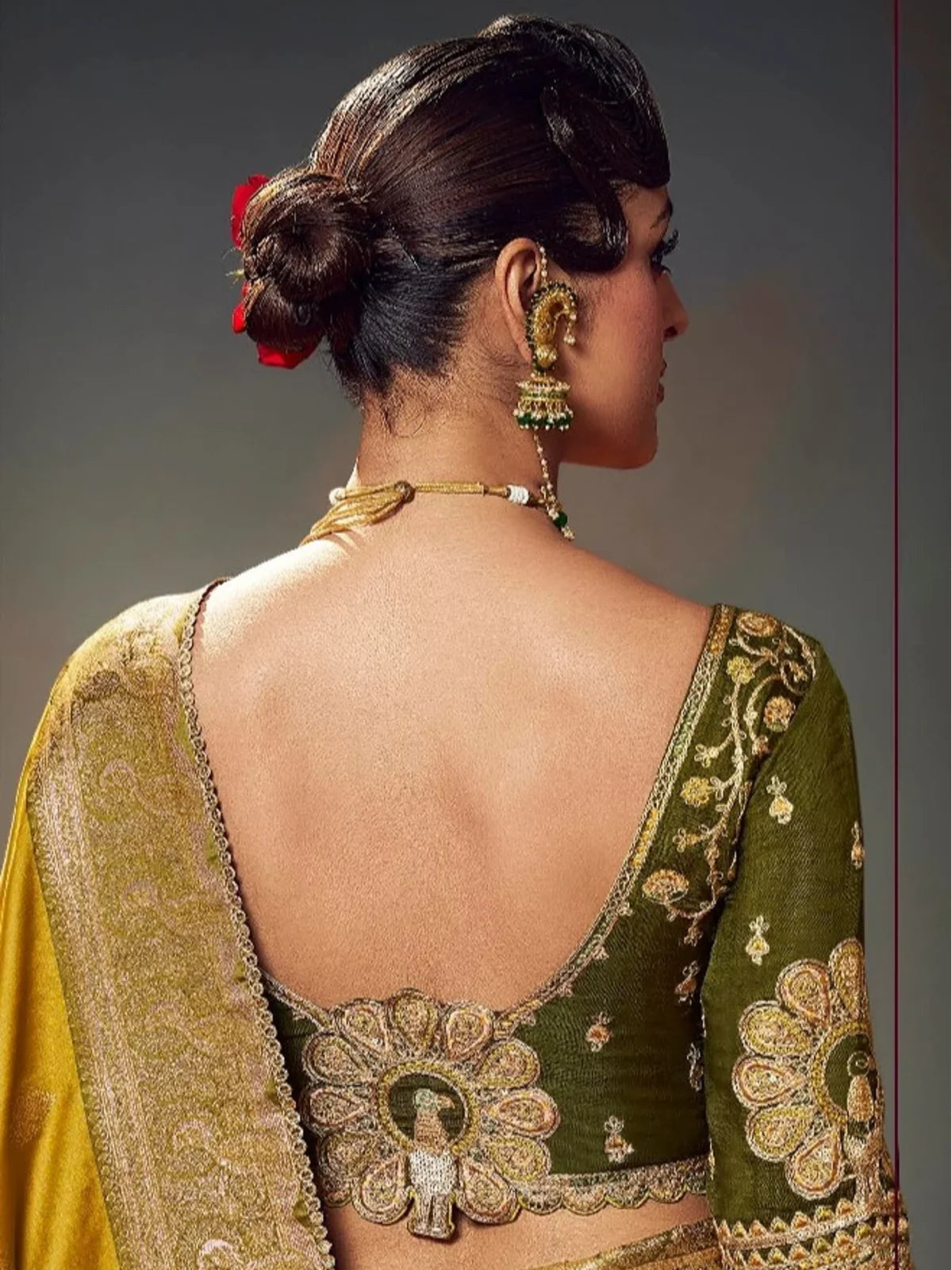 Tarani mustard yellow satin silk saree back view with designer blouse and intricate zari work