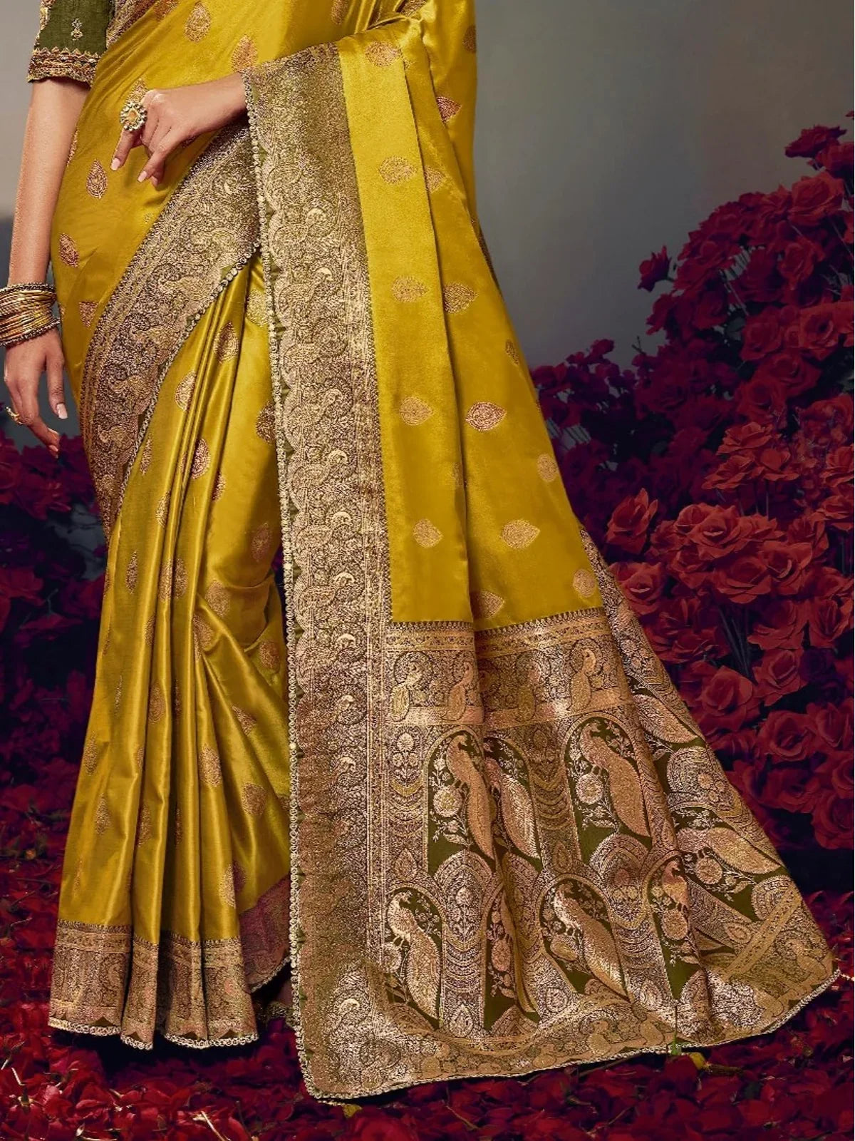 Tarani mustard yellow satin silk saree pallu view highlighting zari woven peacock design border