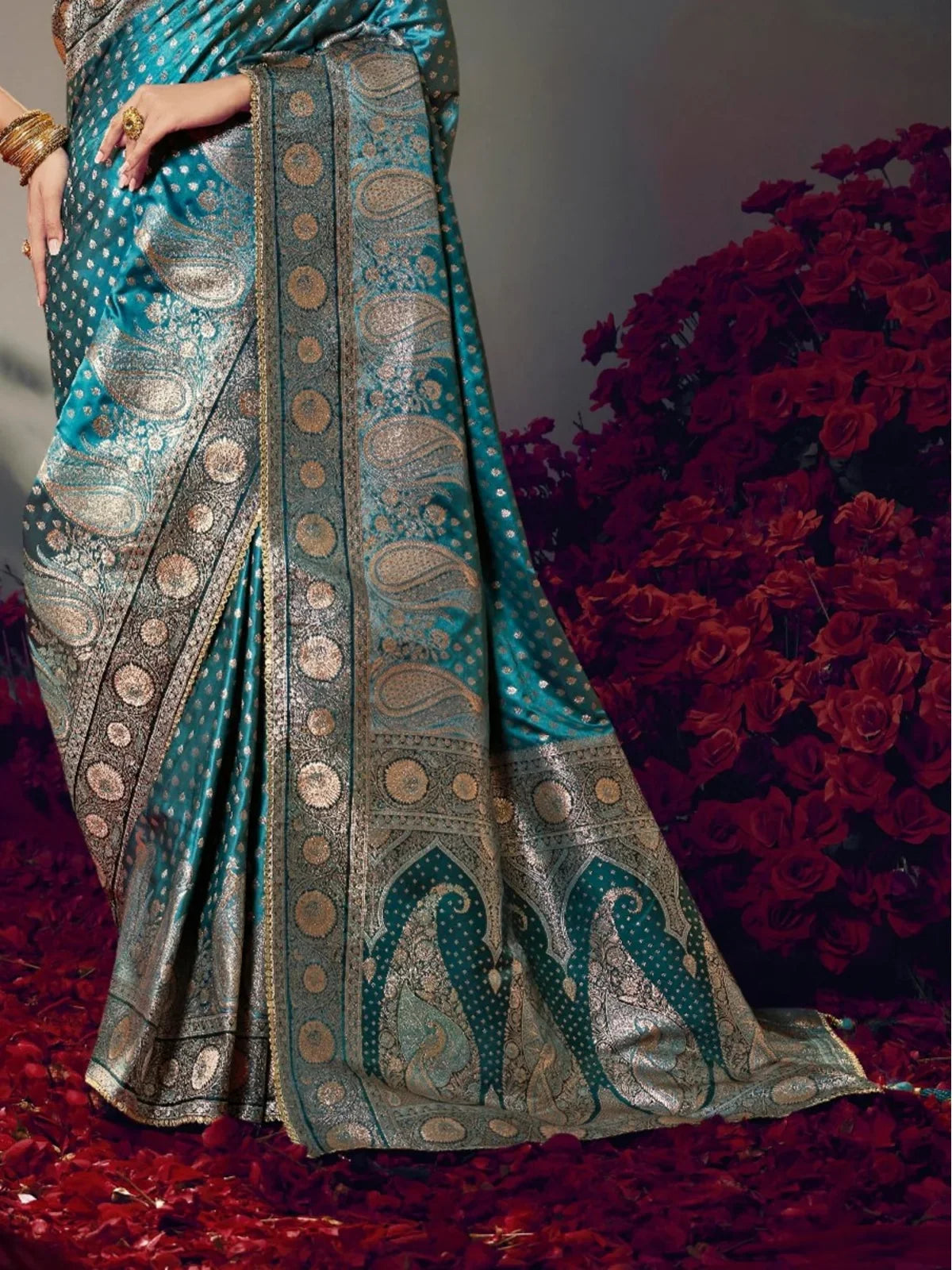 Tarani teal satin silk saree pallu view showcasing peacock and paisley zari motifs