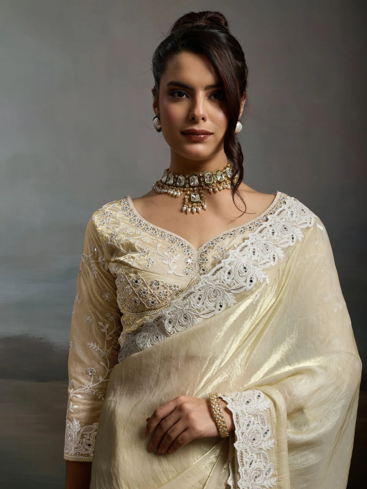 Tarani off white satin velvet saree upper body view with embroidered blouse and handwork details
