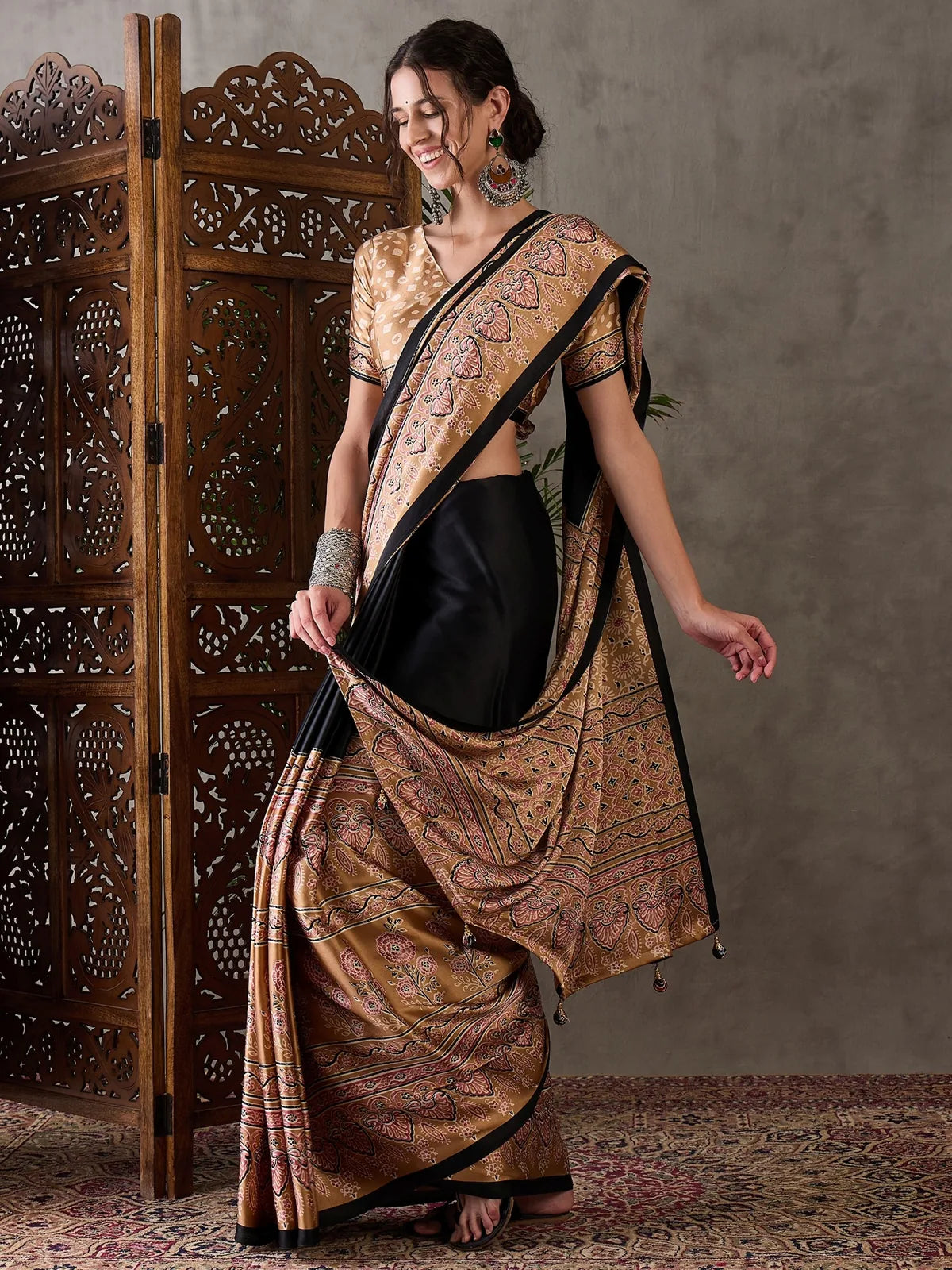Tarani Dharika black semi modal satin printed saree front pose showcasing pallu and drape