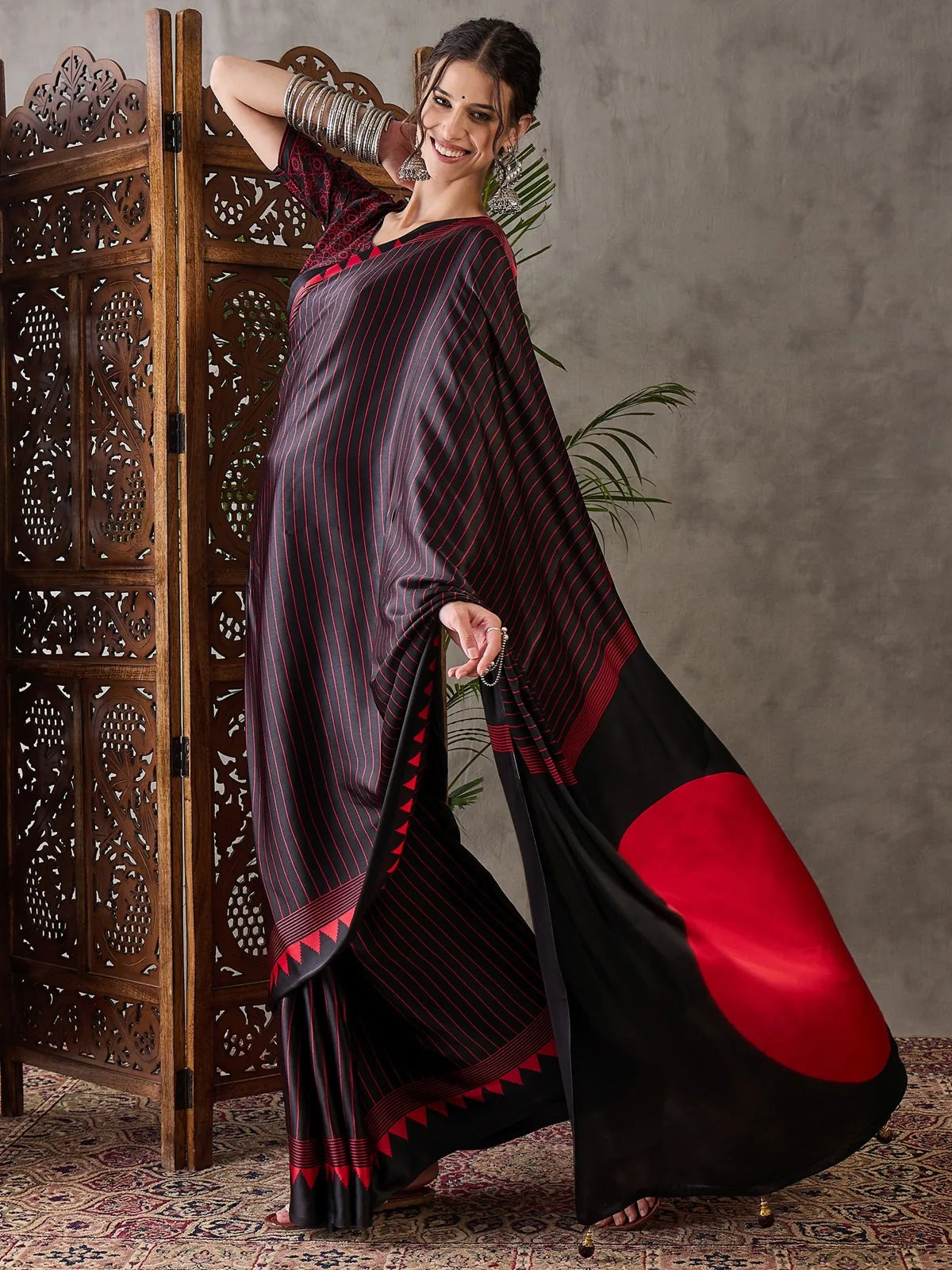 Tarani Rajvi black semi modal satin saree pallu view with red statement design