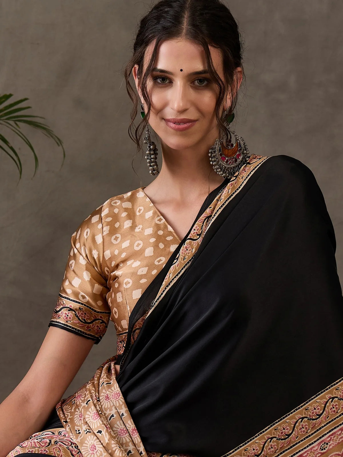 Tarani Dharika black semi modal satin printed saree upper body portrait with designer border