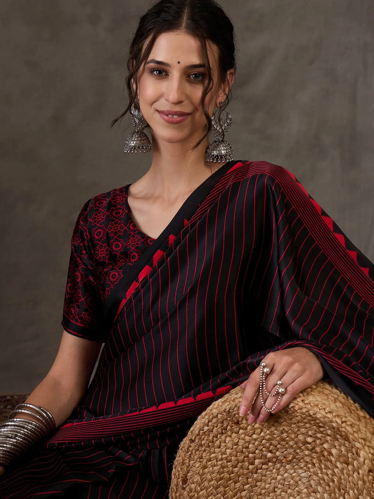 Tarani Rajvi upper body view black printed semi modal satin festive saree