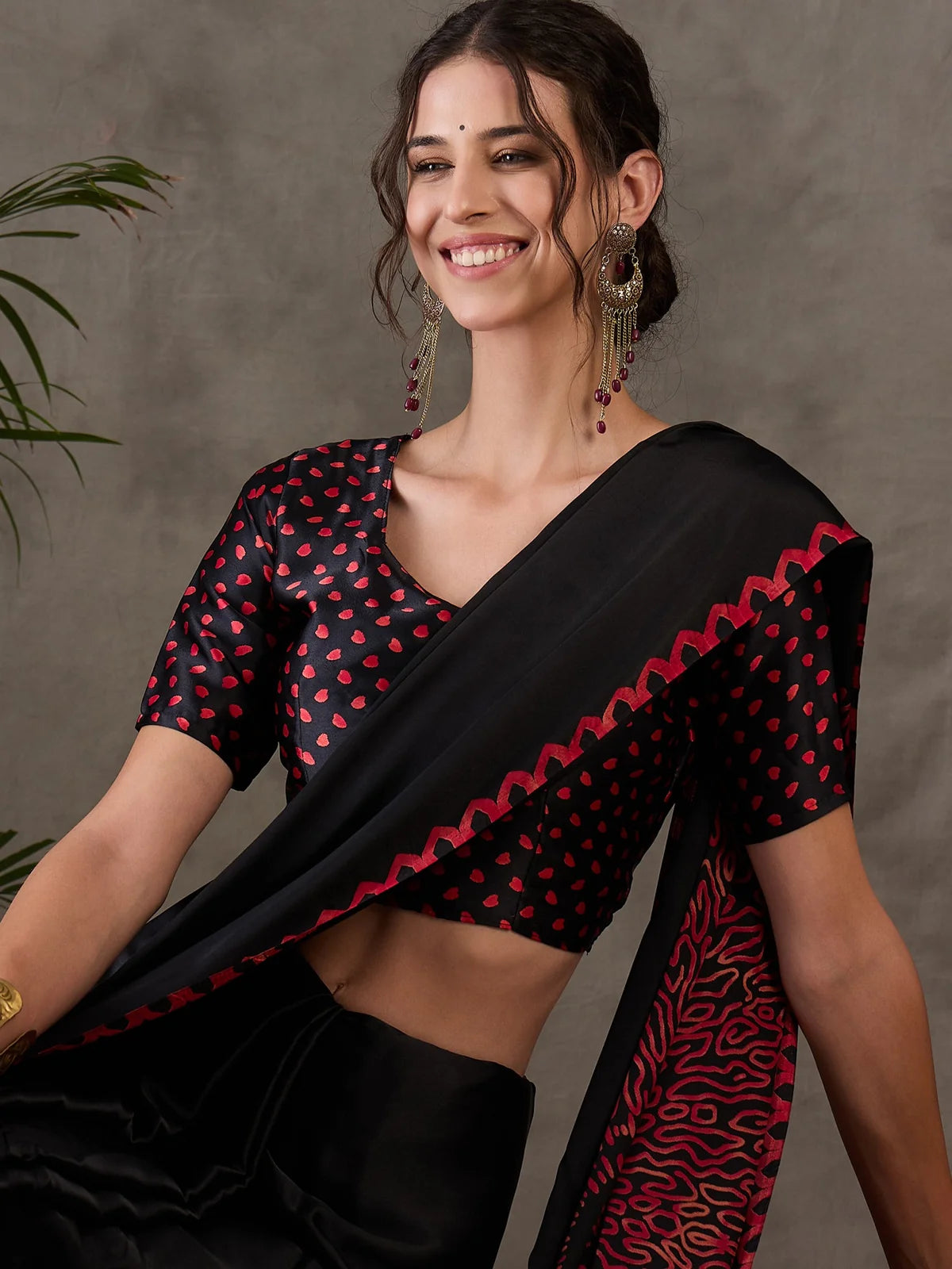 Tarani black saree upper body view showing printed blouse and border