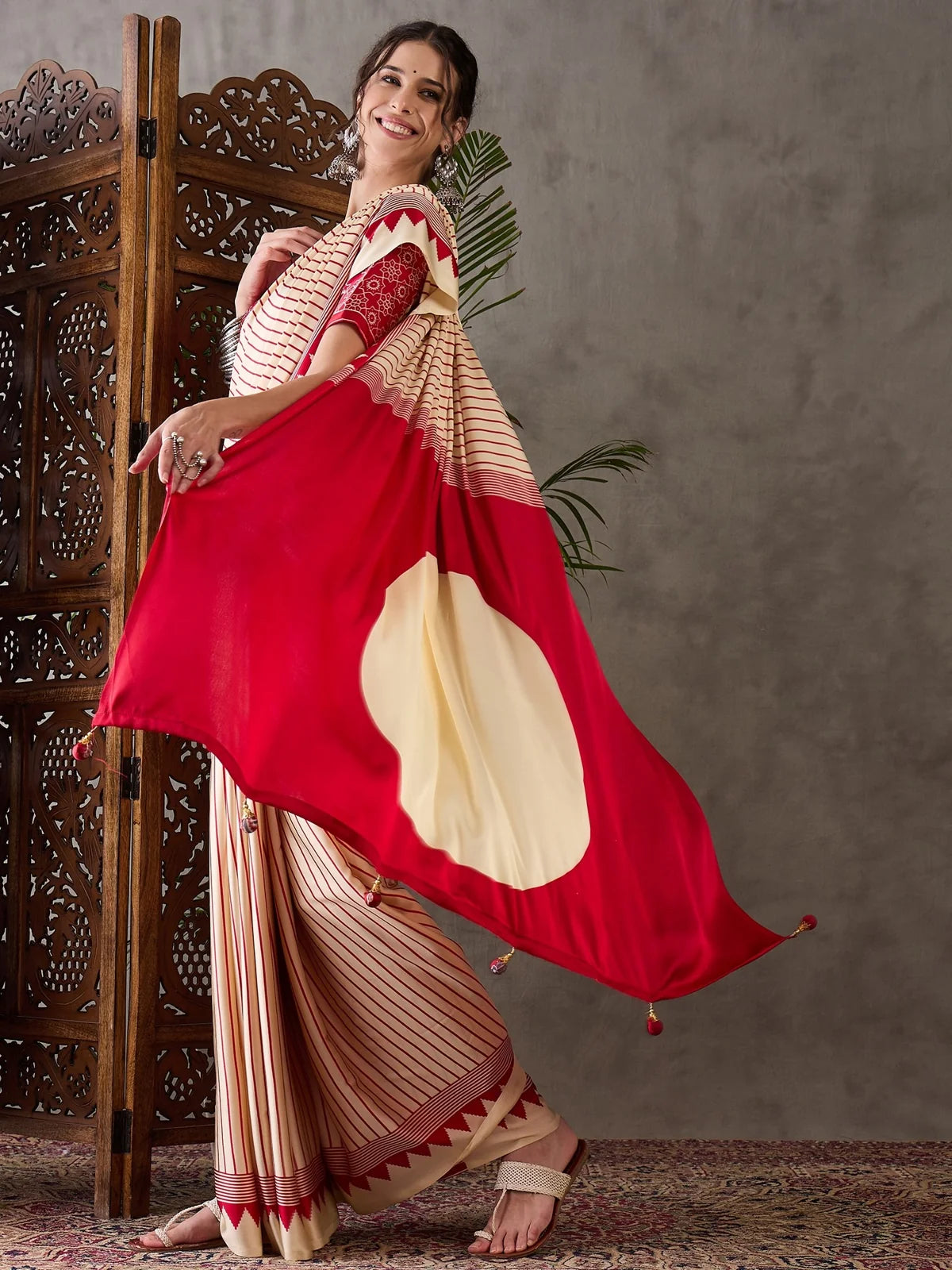 Tarani Malini cream striped saree pallu view with red designer border