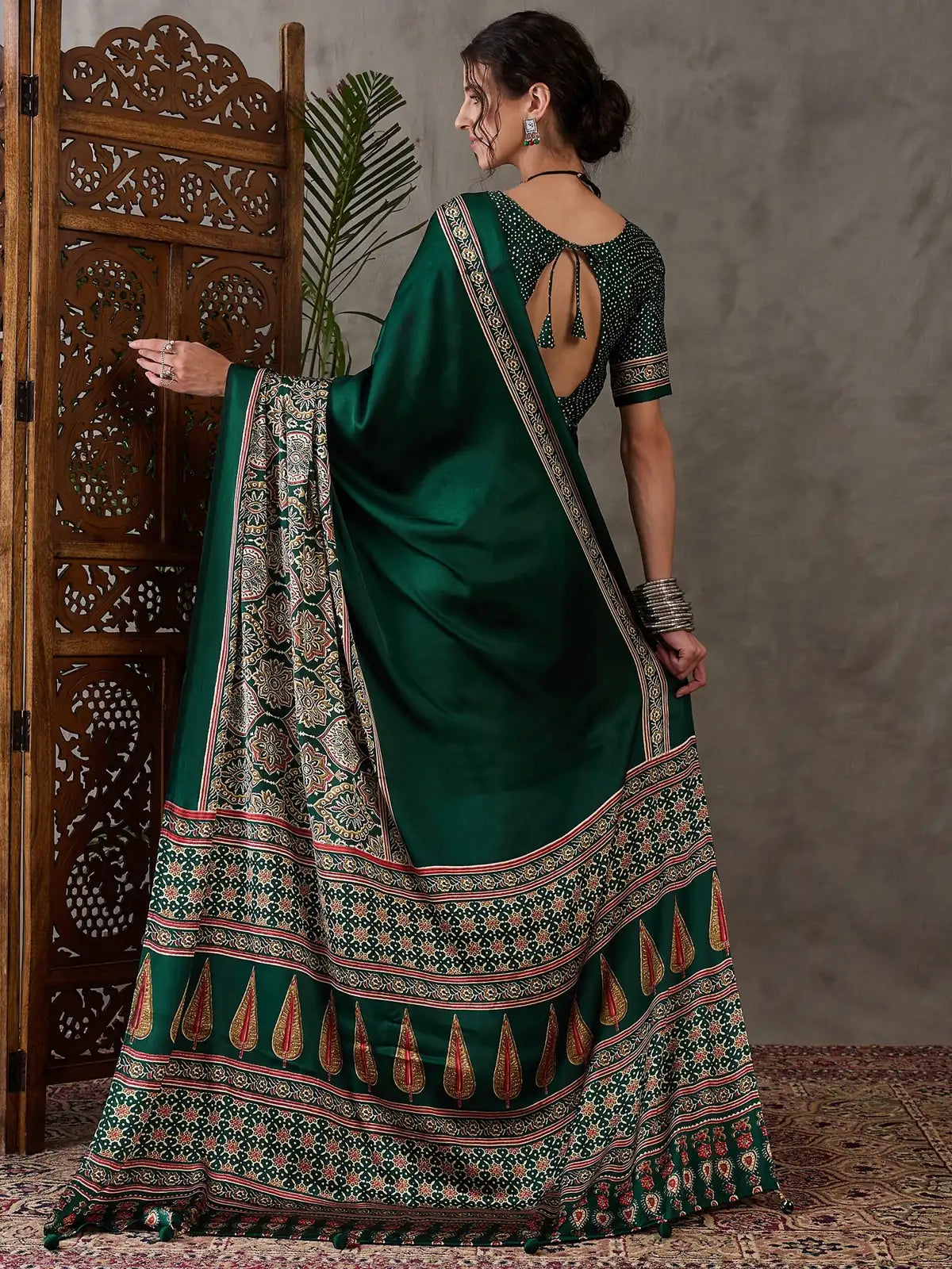 Tarani green semi modal satin saree back view showing blouse back pattern