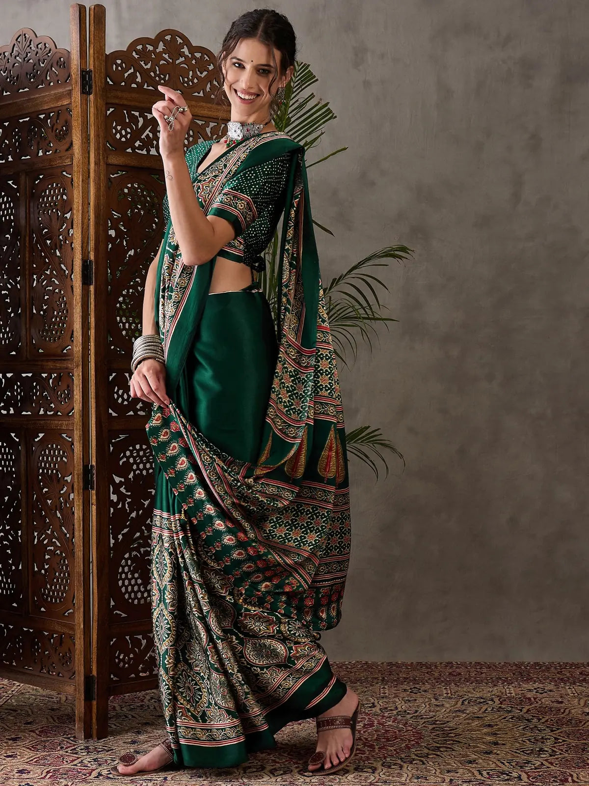 Tarani green printed saree side view showing drape and pallu movement