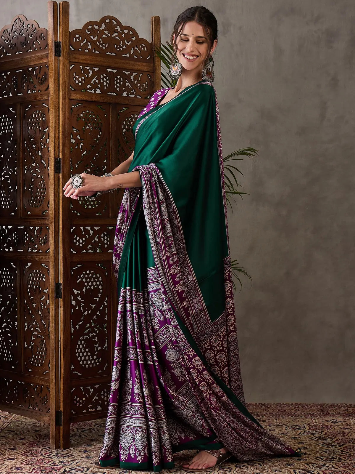 Tarani Sujata green printed saree elegant side pose