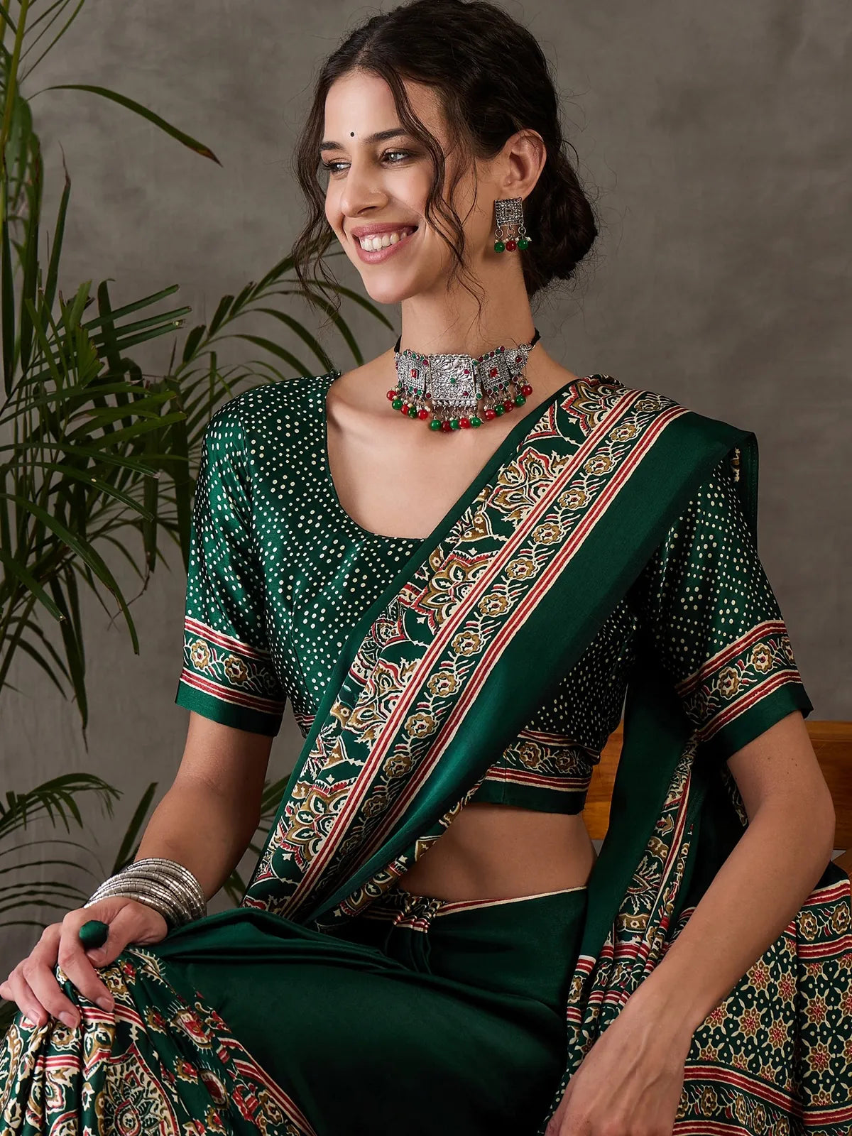 Tarani green semi modal satin saree close upper body view with printed border details