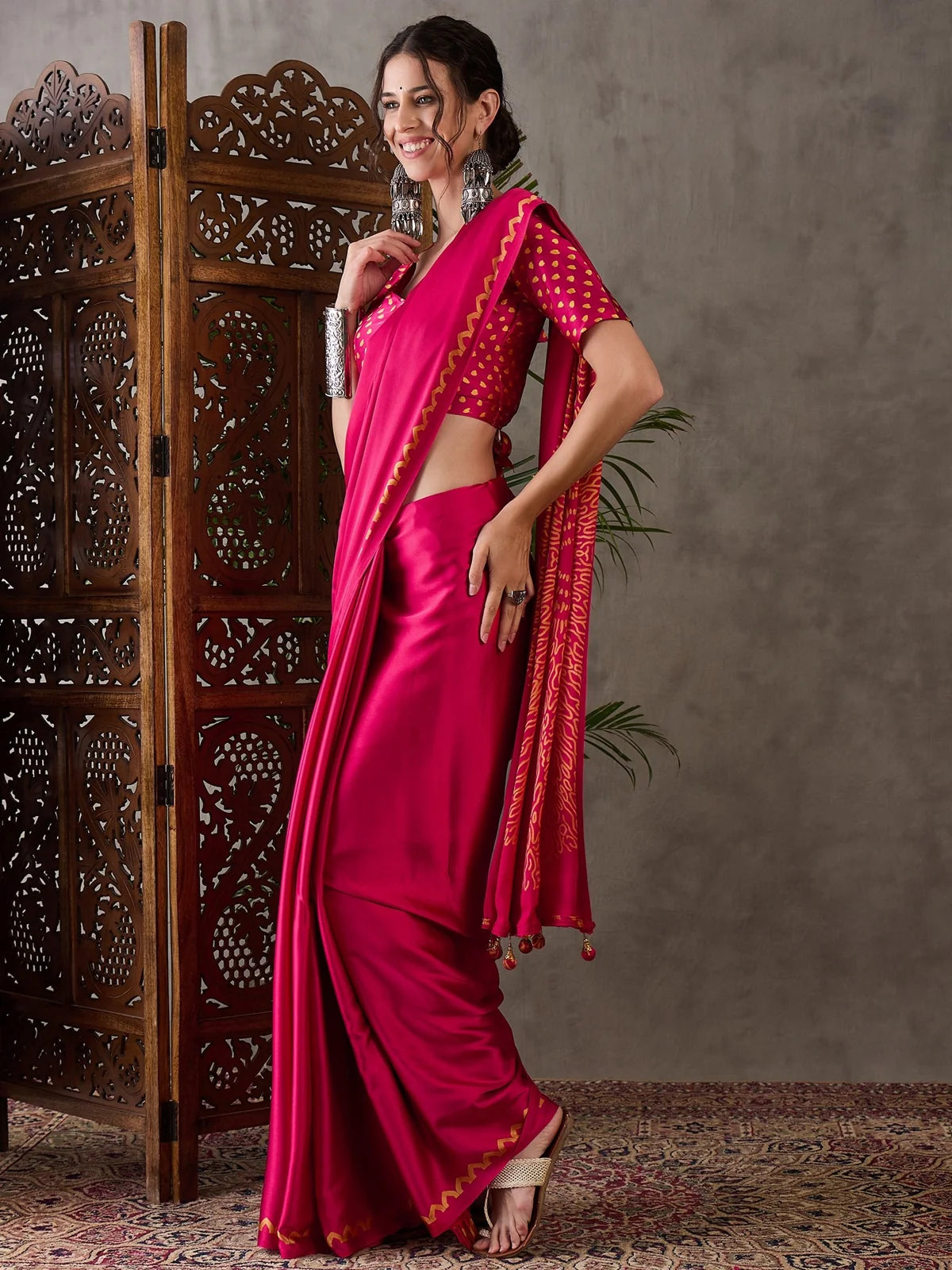Tarani magenta semi modal satin saree side view with elegant drape