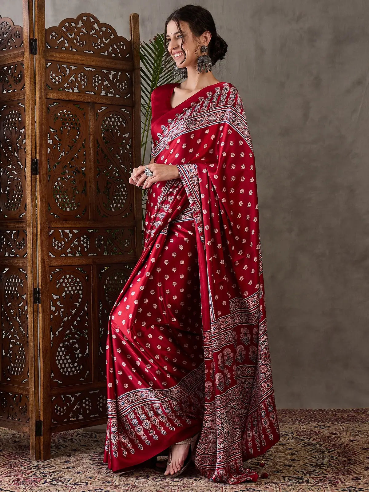 Tarani Rajlaxmi maroon semi modal satin saree side view with pallu