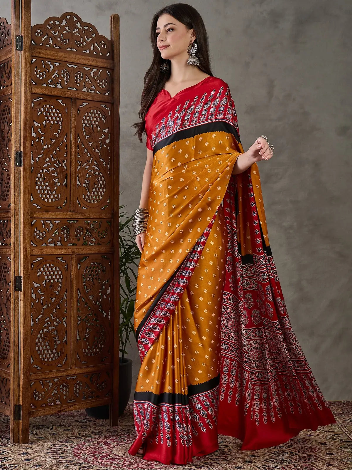 Tarani Aashini mustard printed saree elegant side pose showcasing drape