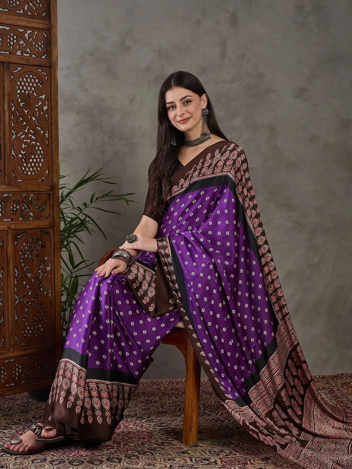 Tarani purple semi modal satin saree seated front view with elegant print