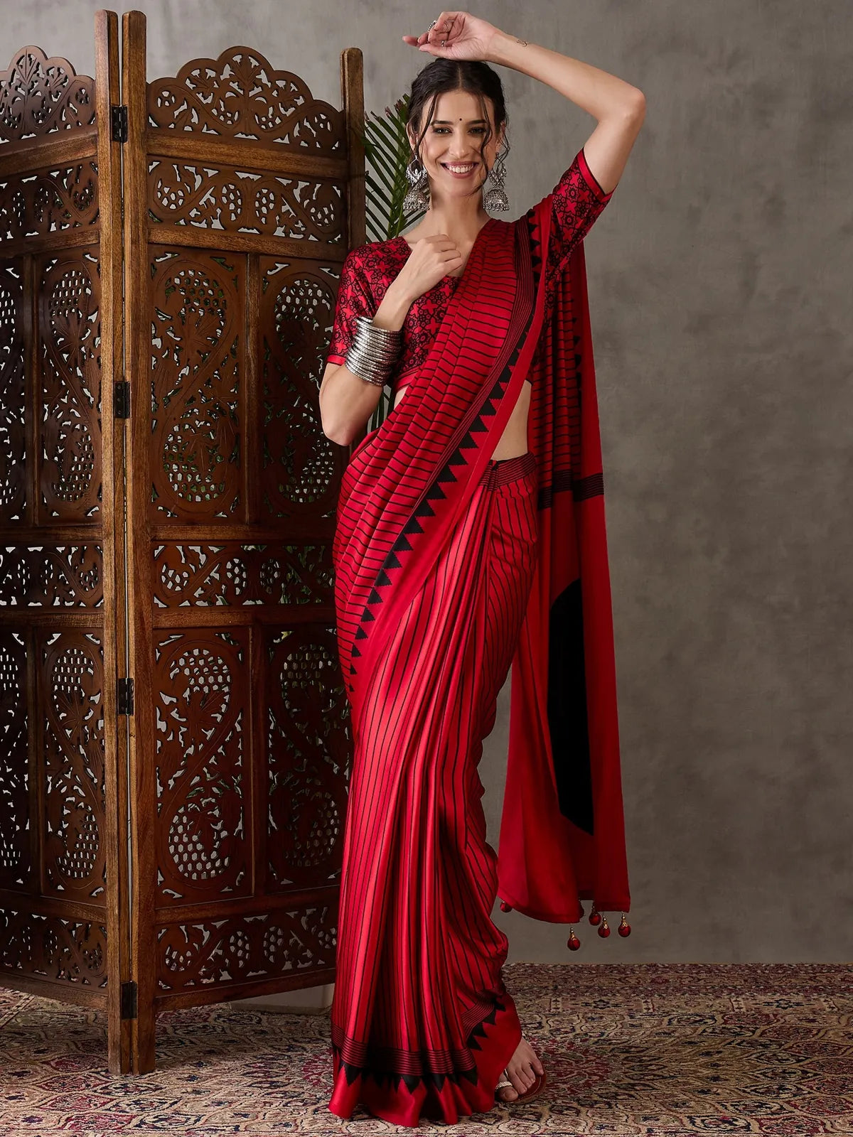 Tarani red semi modal satin printed saree with striped design and blouse for festive party wear