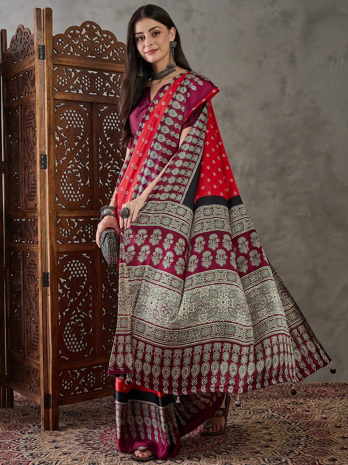 Tarani Aruna red printed saree pallu and border showcase festive wear look