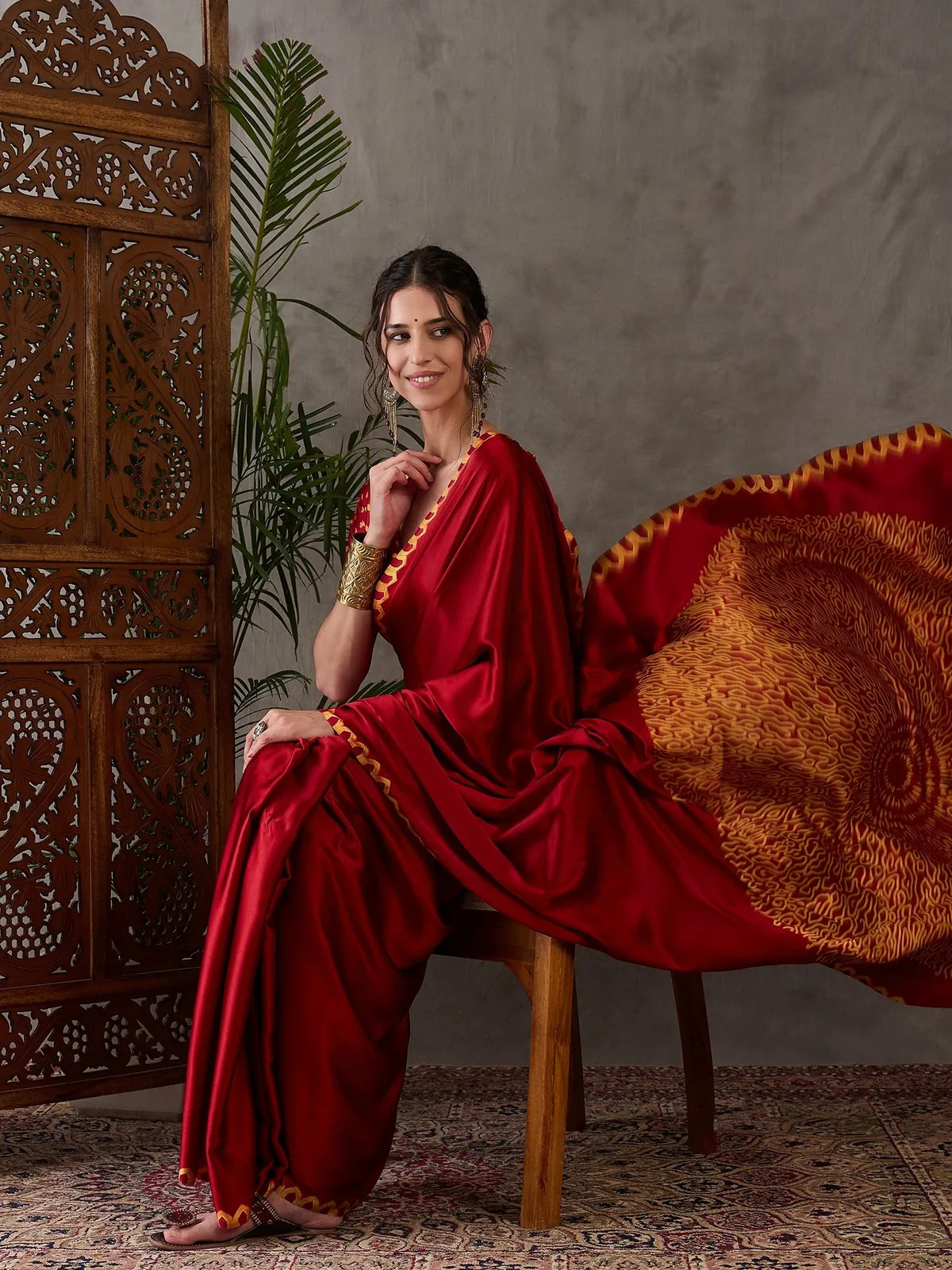 Tarani red semi modal satin festive saree side view highlighting flowing pallu