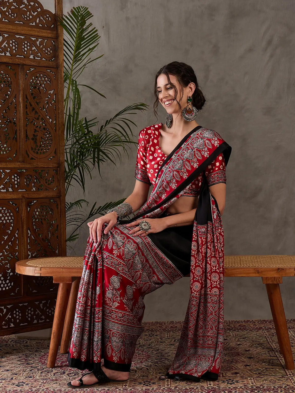 Tarani red printed saree side pose elegant party wear look