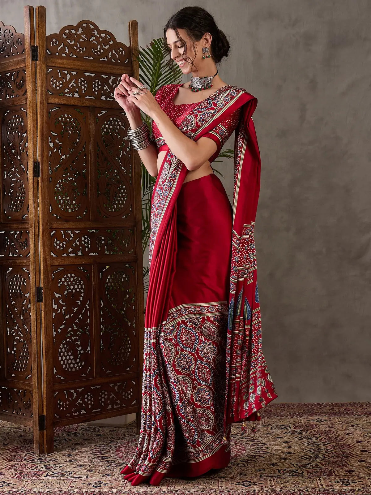 Tarani red Semi Modal Satin saree side pose highlighting drape and border