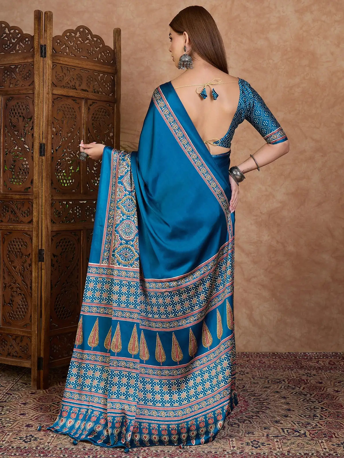Tarani Fulrani teal printed saree back view with designer blouse pattern
