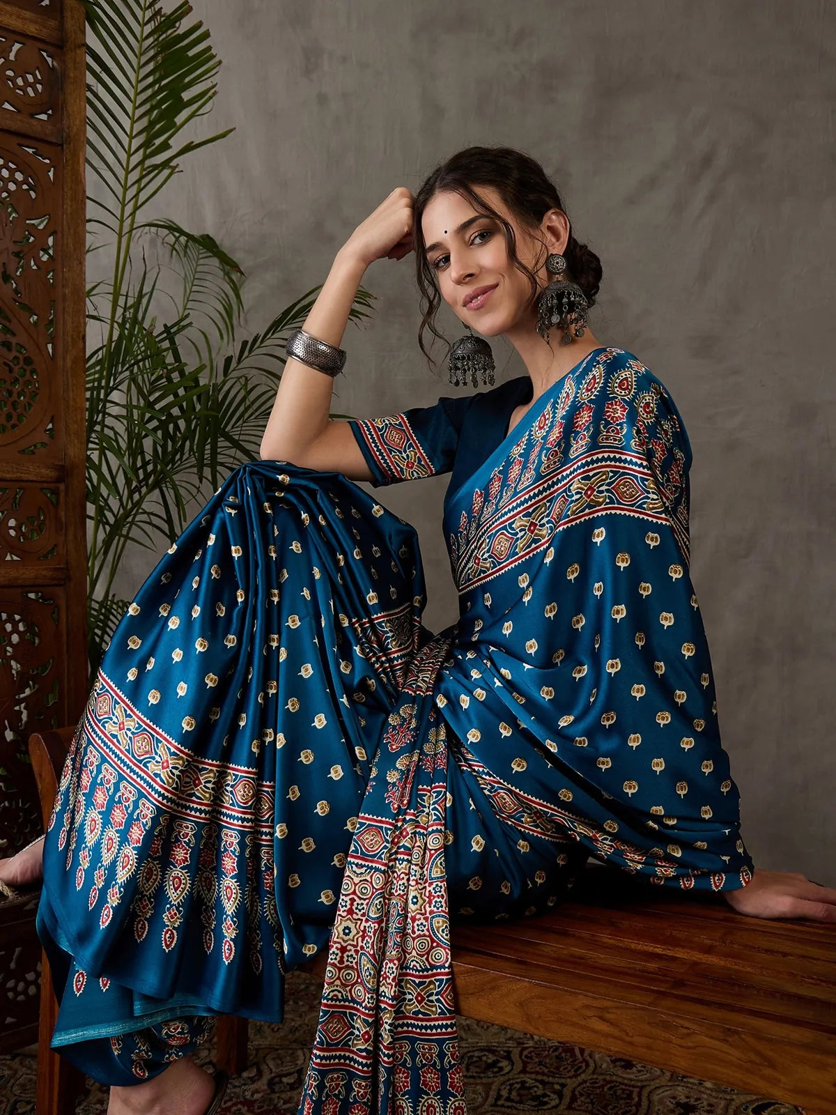 Tarani Namrata teal printed saree side pose highlighting border and drape
