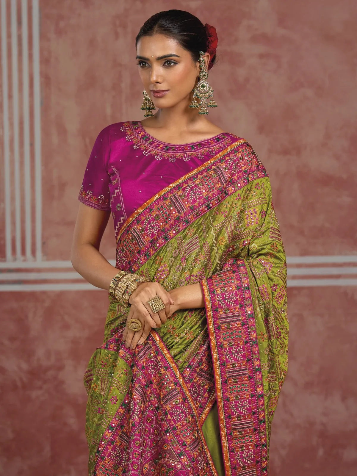 Tarani Shana Silk green saree upper body view showing Kachhi diamond mirror work blouse and border