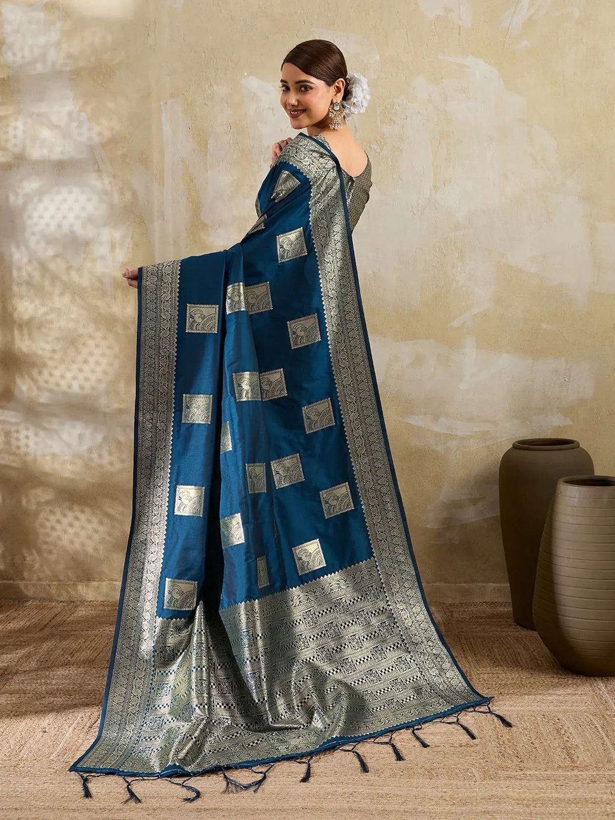 Tarani blue zari work saree back view highlighting elegant pallu design