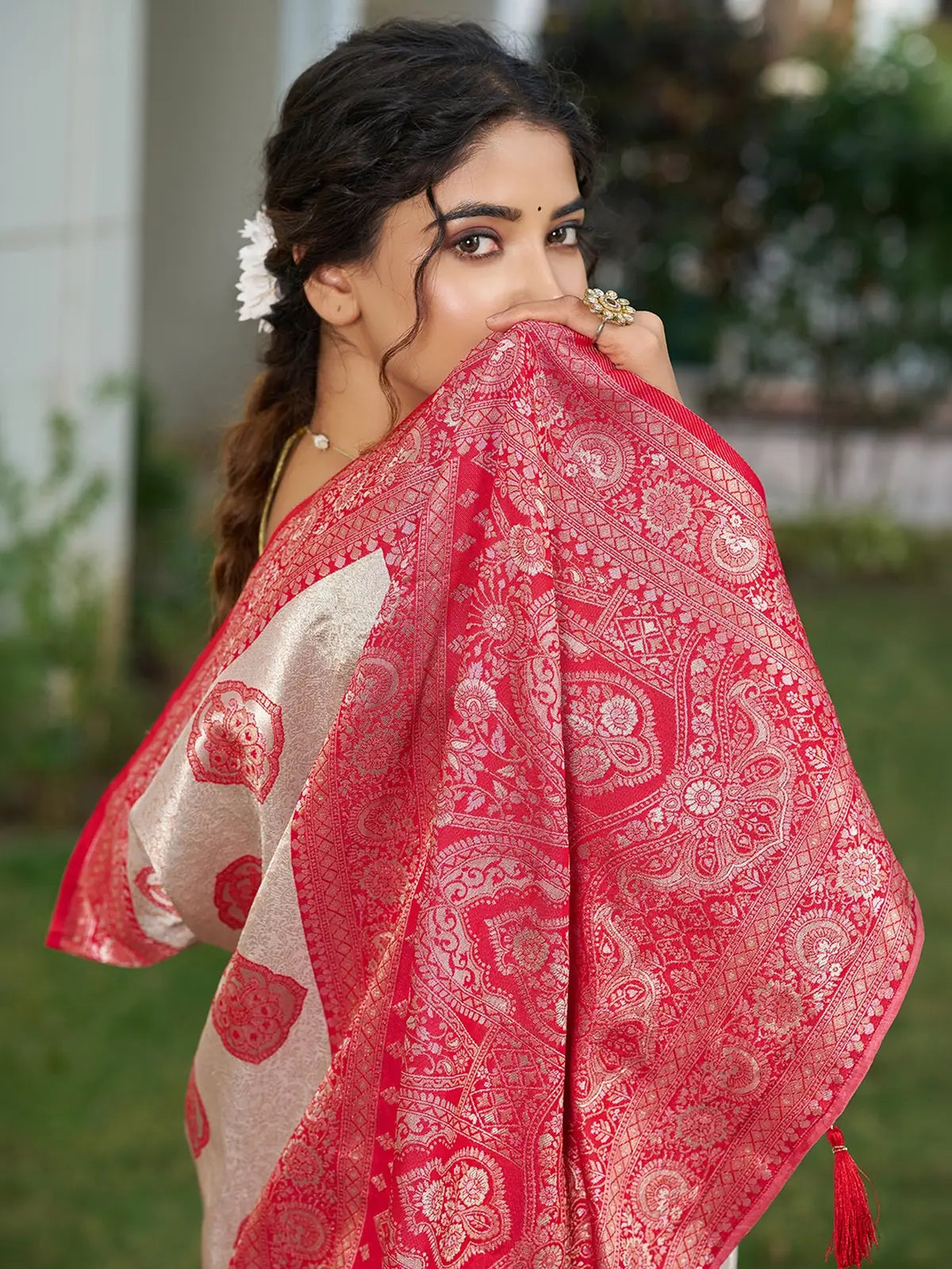 Tarani Shravya red silk blend saree closeup view featuring zari woven pallu and detailed motifs