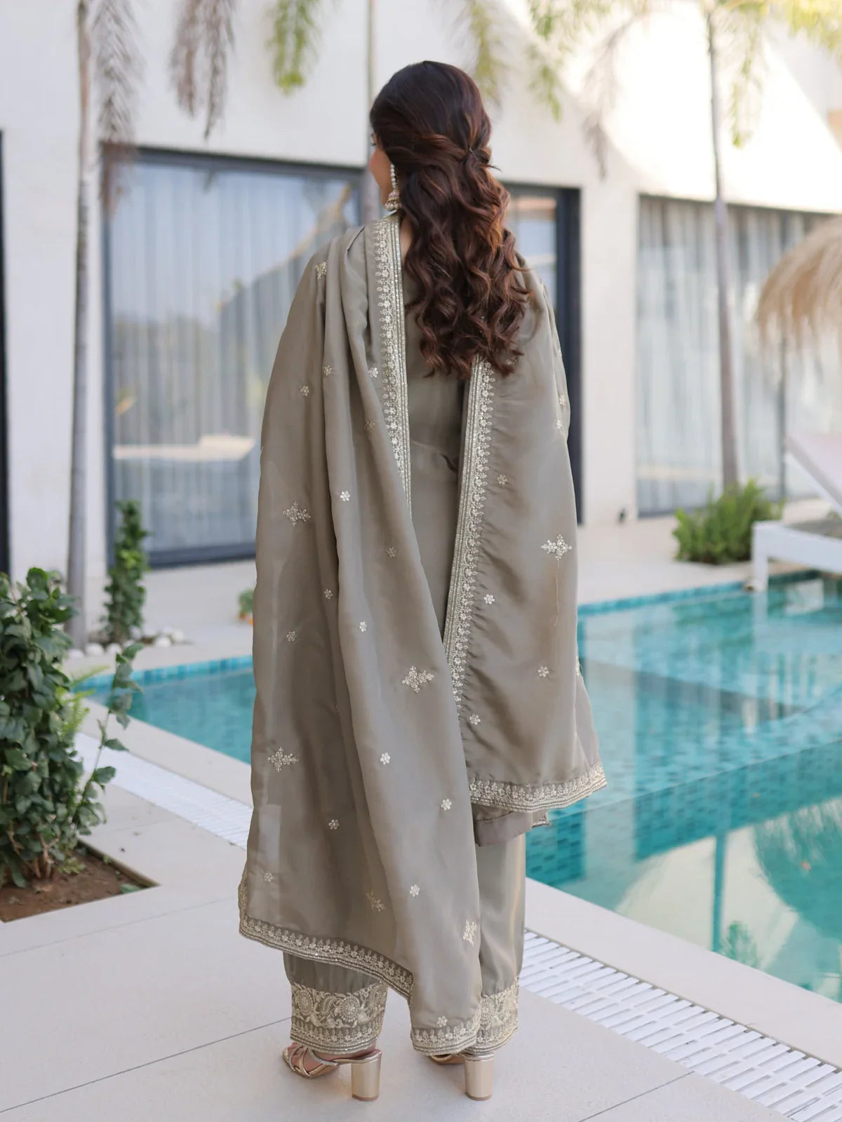 Tarani beige silk embroidered festive dress back view with flowing dupatta