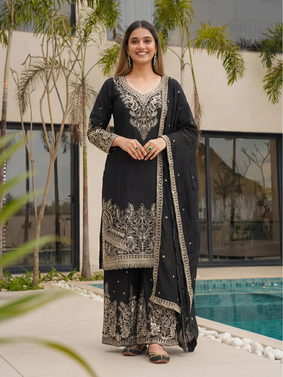 Tarani black chinon silk sharara suit set front view with golden embroidery and festive look
