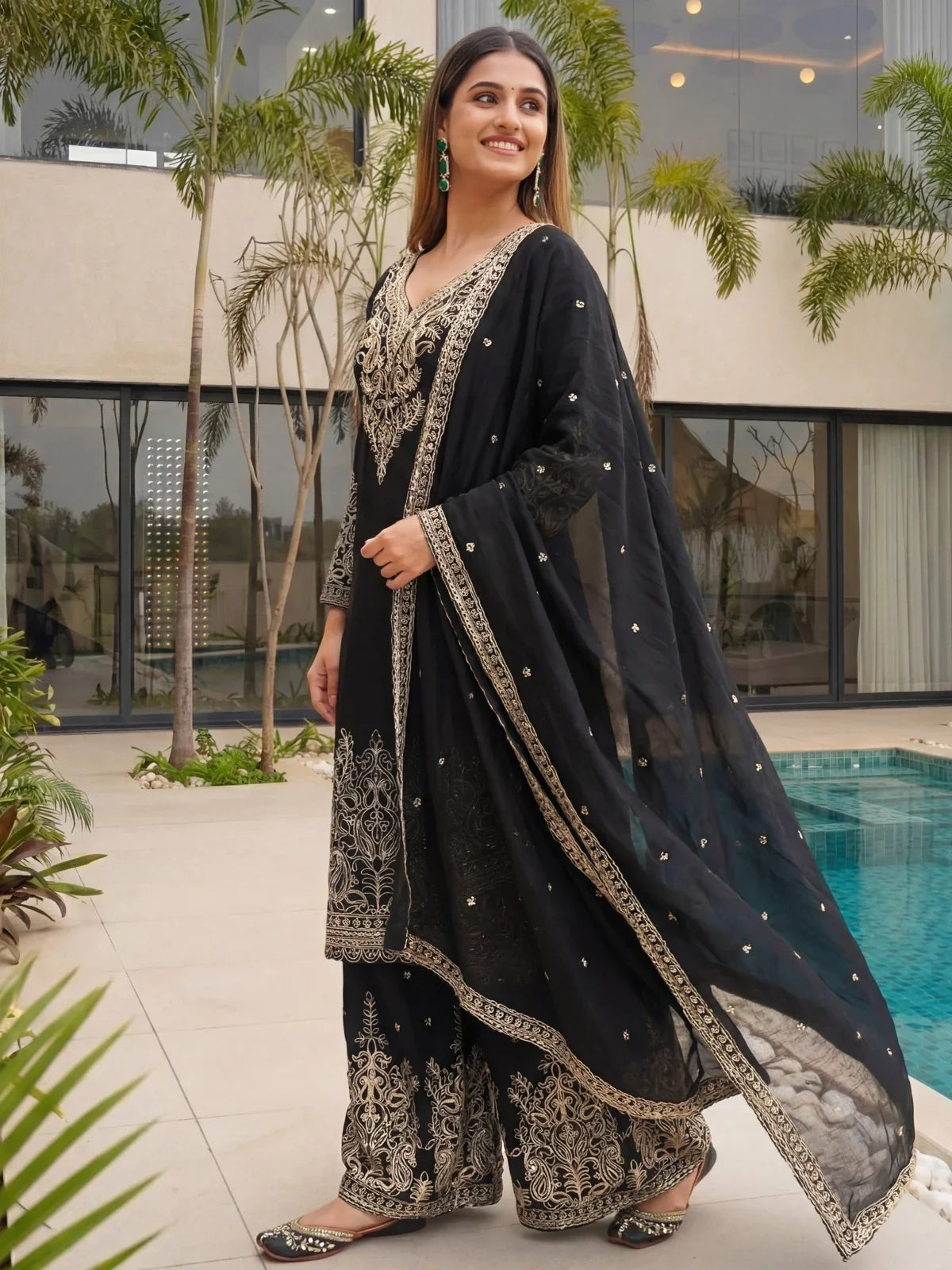 Tarani elegant black dress side profile with flowing dupatta and ethnic embroidery