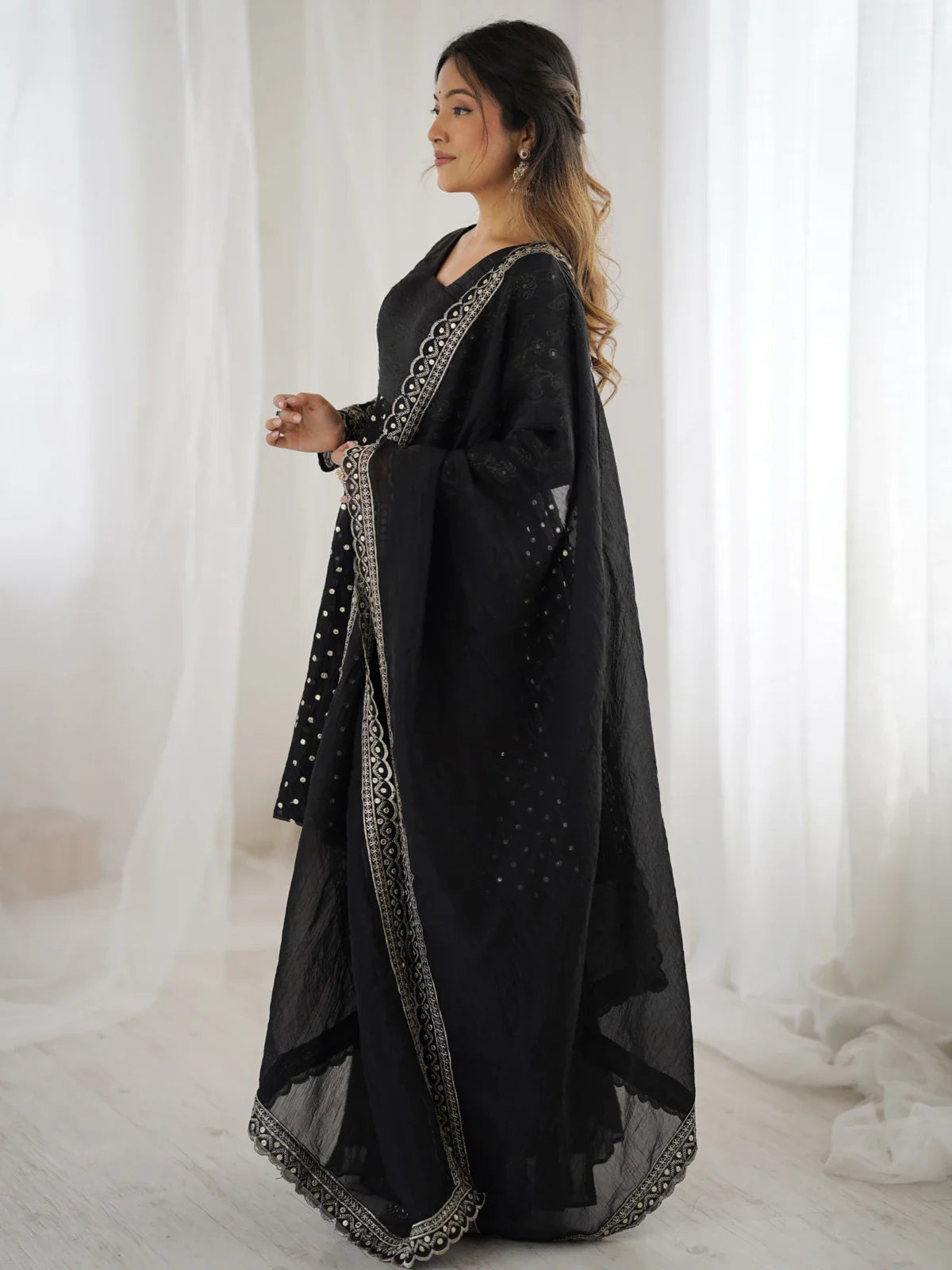 Tarani black silk sharara side profile with embroidered dupatta