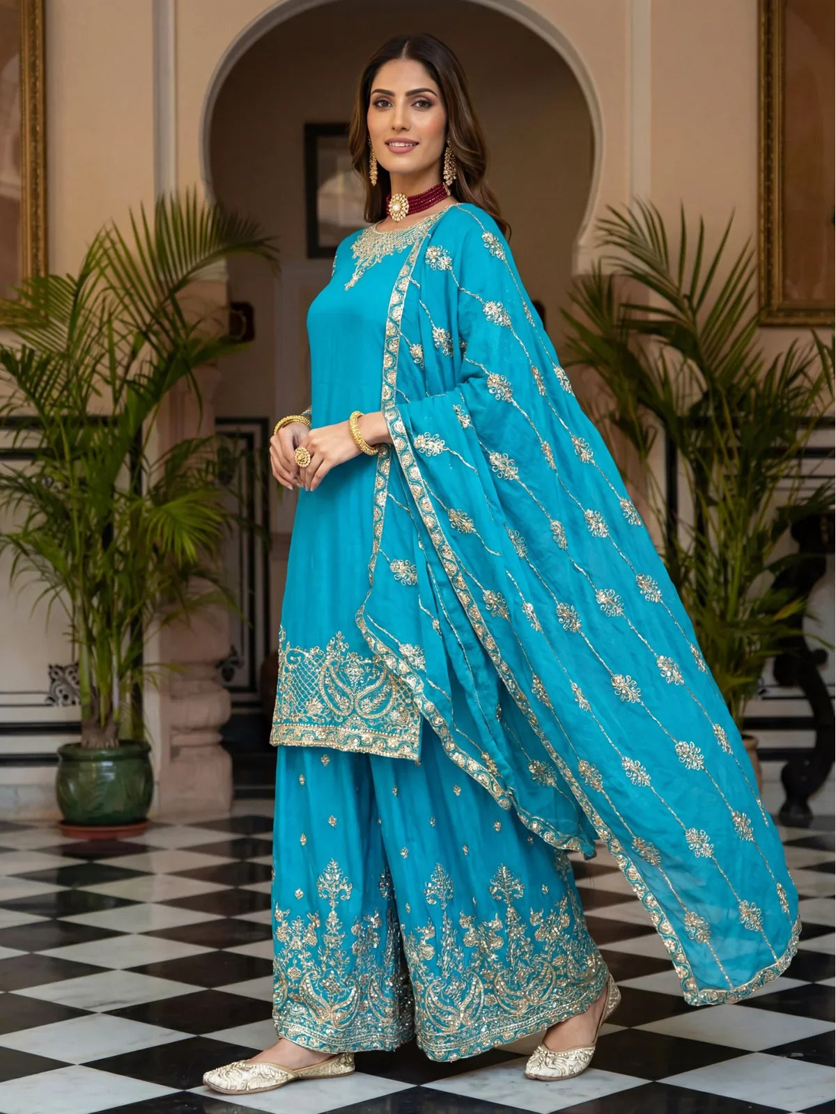 Tarani blue chinon silk dress side pose showing dupatta drape and sleeve embroidery