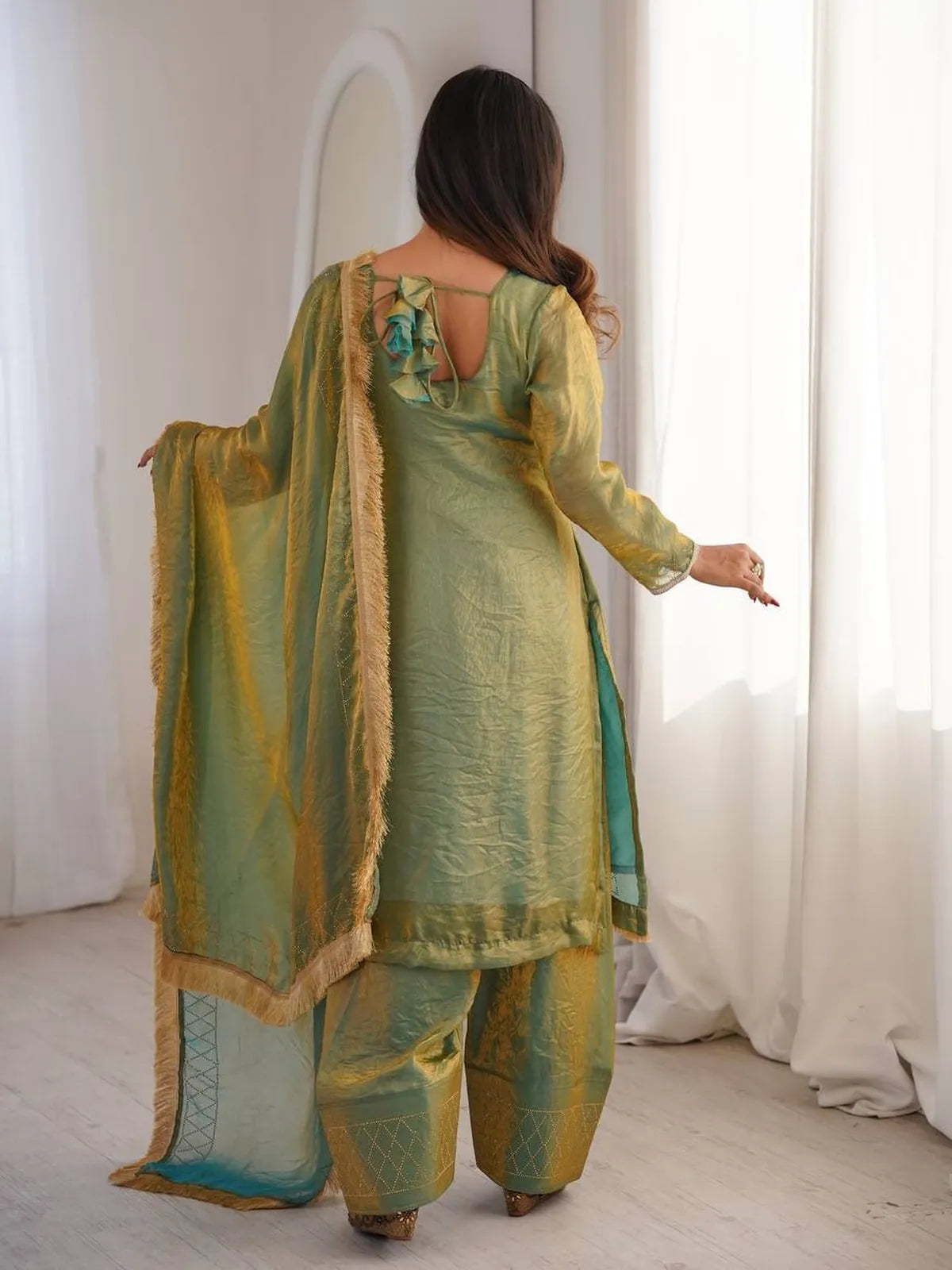 Tarani green silk dress back view with bow design and draped dupatta