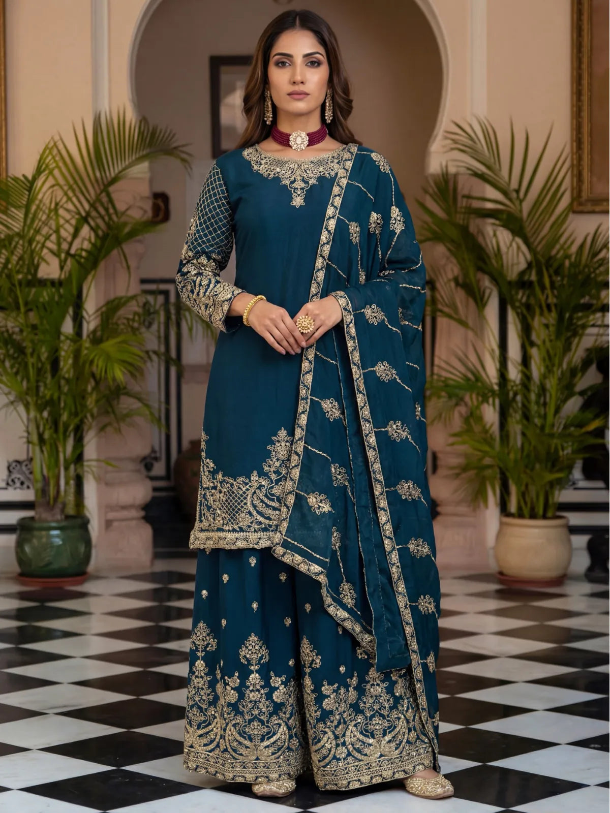 Tarani green Chinon silk dress with gold zari embroidery shown in full view with palazzo and dupatta