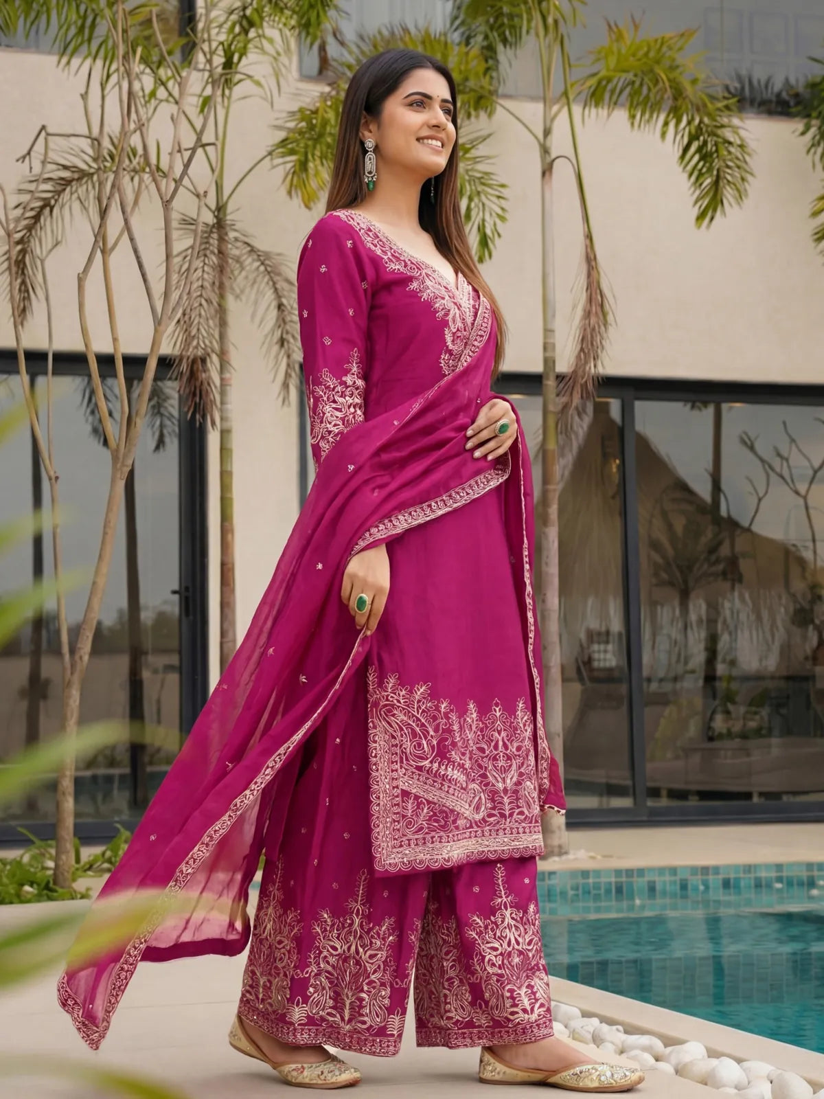 Tarani magenta Chinon Silk sharara suit side view with flowing dupatta and sleeve embroidery
