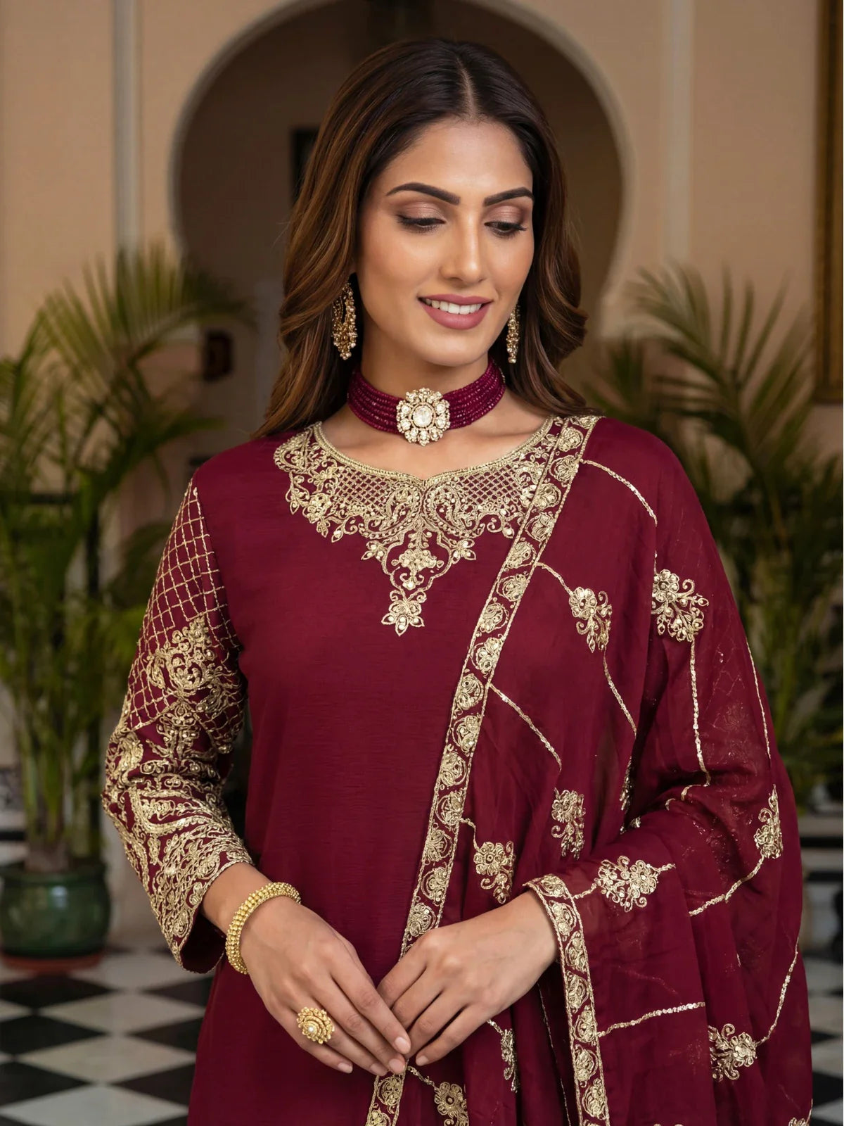 Tarani maroon chinon silk dress closeup showcasing neck embroidery and sleeve work